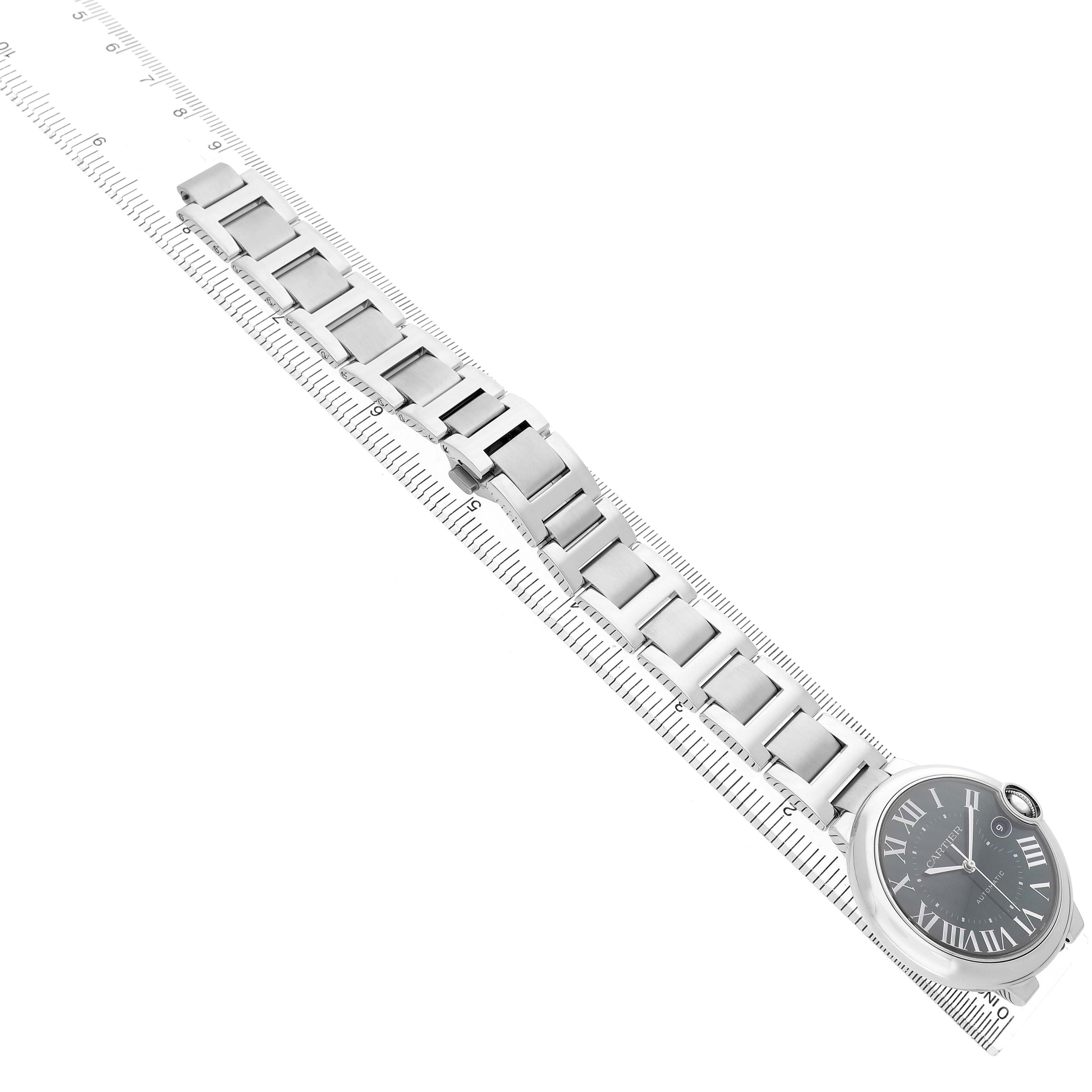 The Cartier Ballon Bleu WSBB0071 Men's Stainless Steel Green Dial watch is shown from an overhead angle, displaying the dial and full metal bracelet.