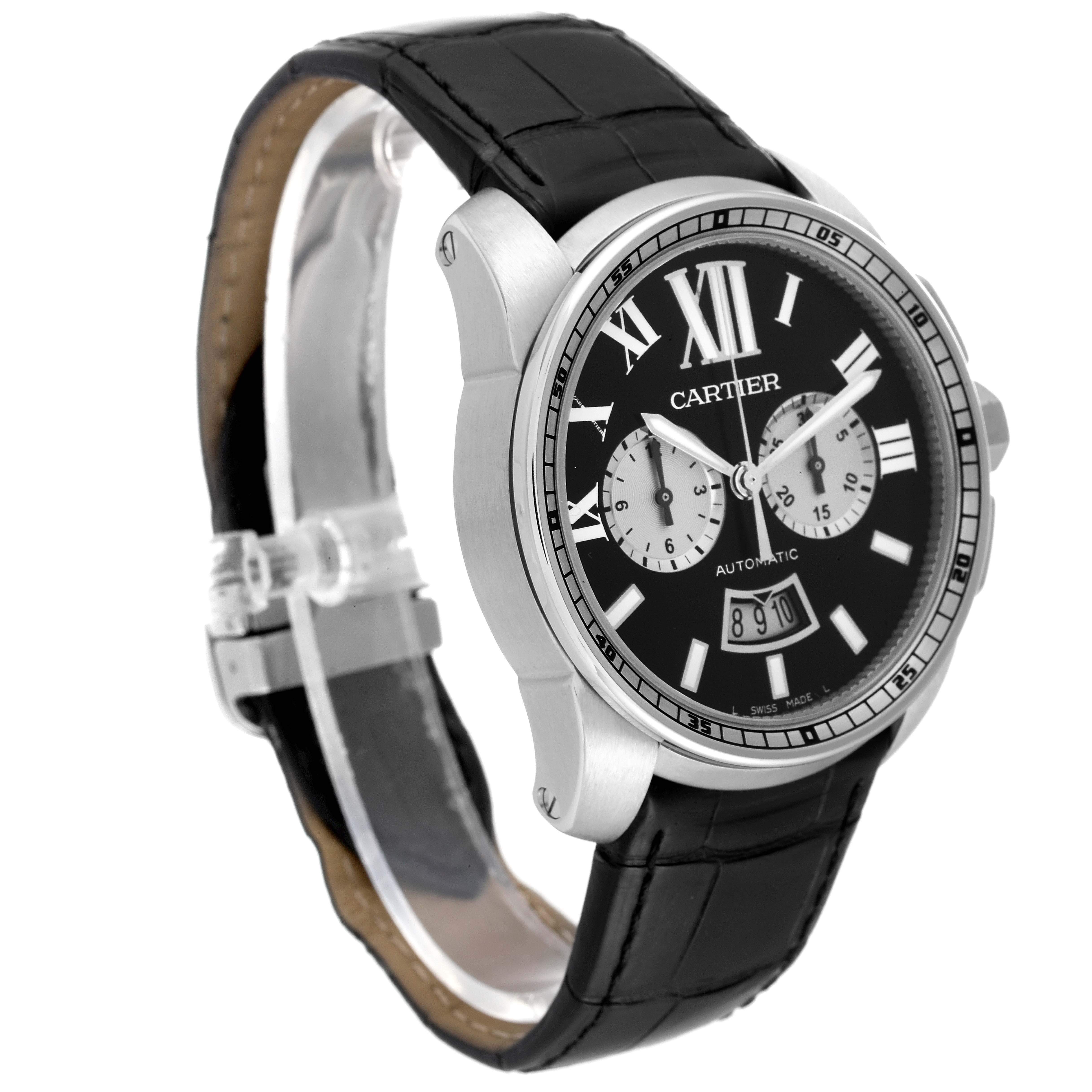 This image shows a Calibre de Cartier watch by Cartier at a slight angle, highlighting its black dial, Roman numerals, and black leather strap.
