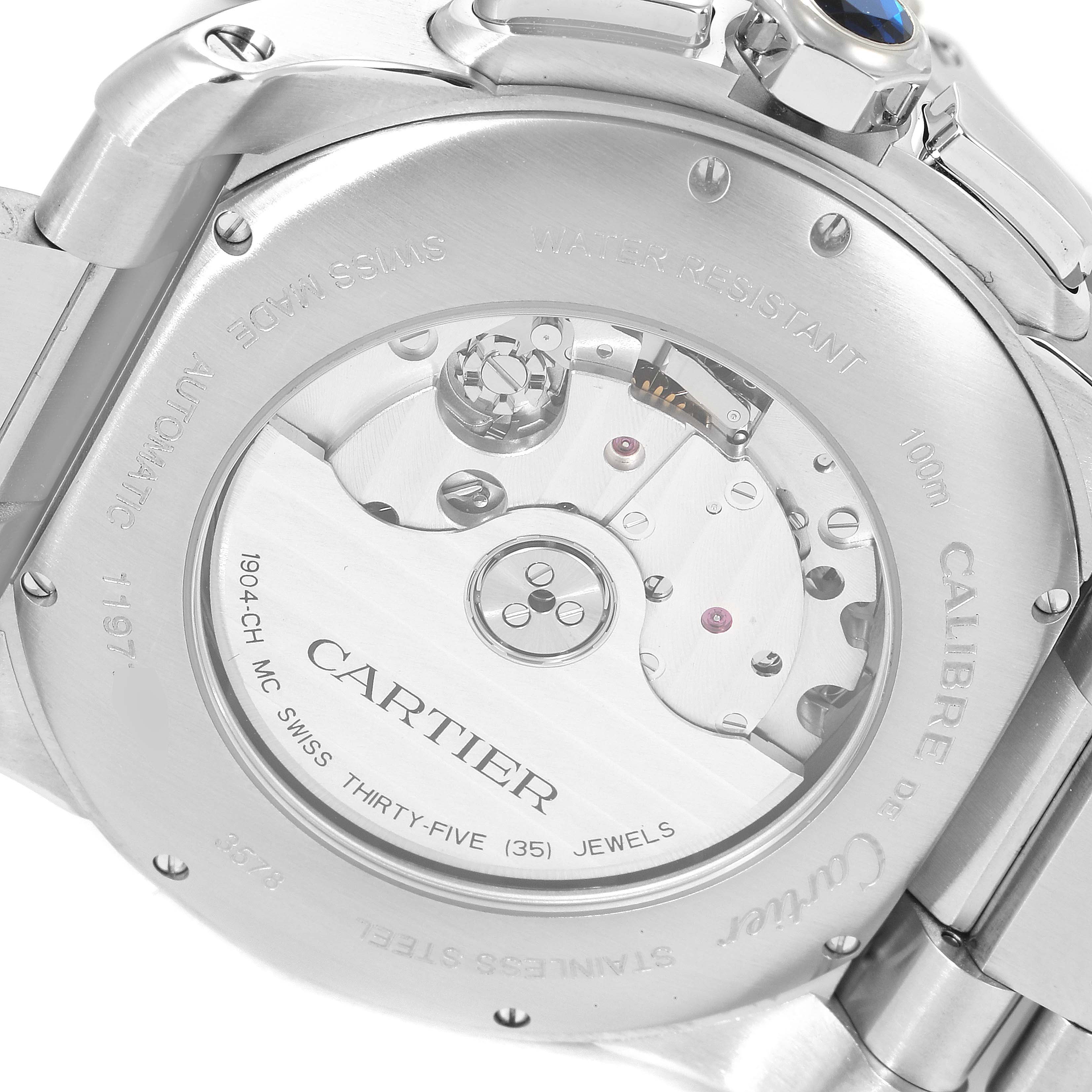 The image shows the back case of the Calibre de Cartier watch by Cartier, displaying its intricate mechanical movement.