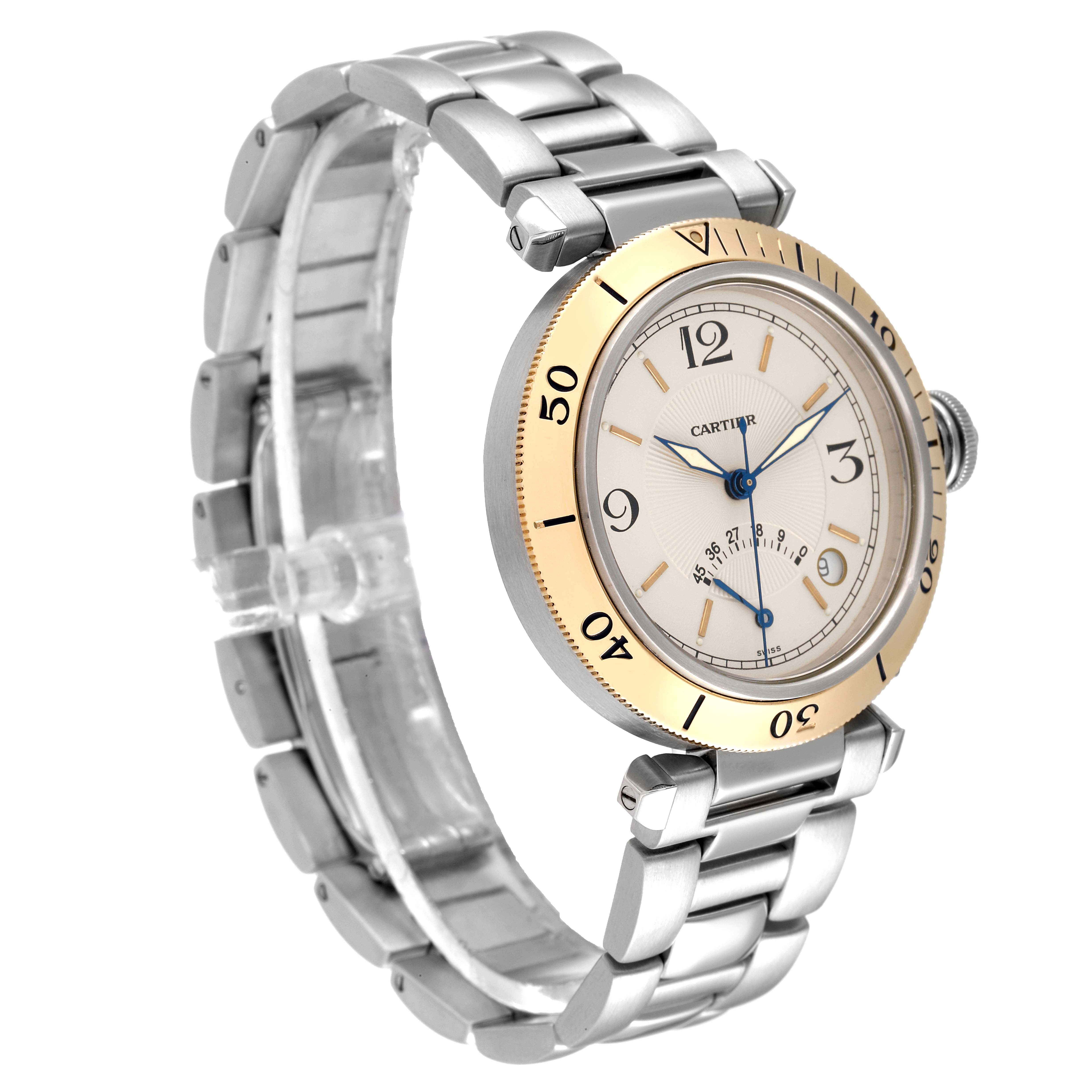 The image shows a Cartier Pasha W3101255 Men
s Steel and Gold (two tone) Silver Dial W3101255 Men
s Steel and Gold (two tone) Silver Dial model watch at an angled side view, highlighting its bracelet, dial, and bezel.