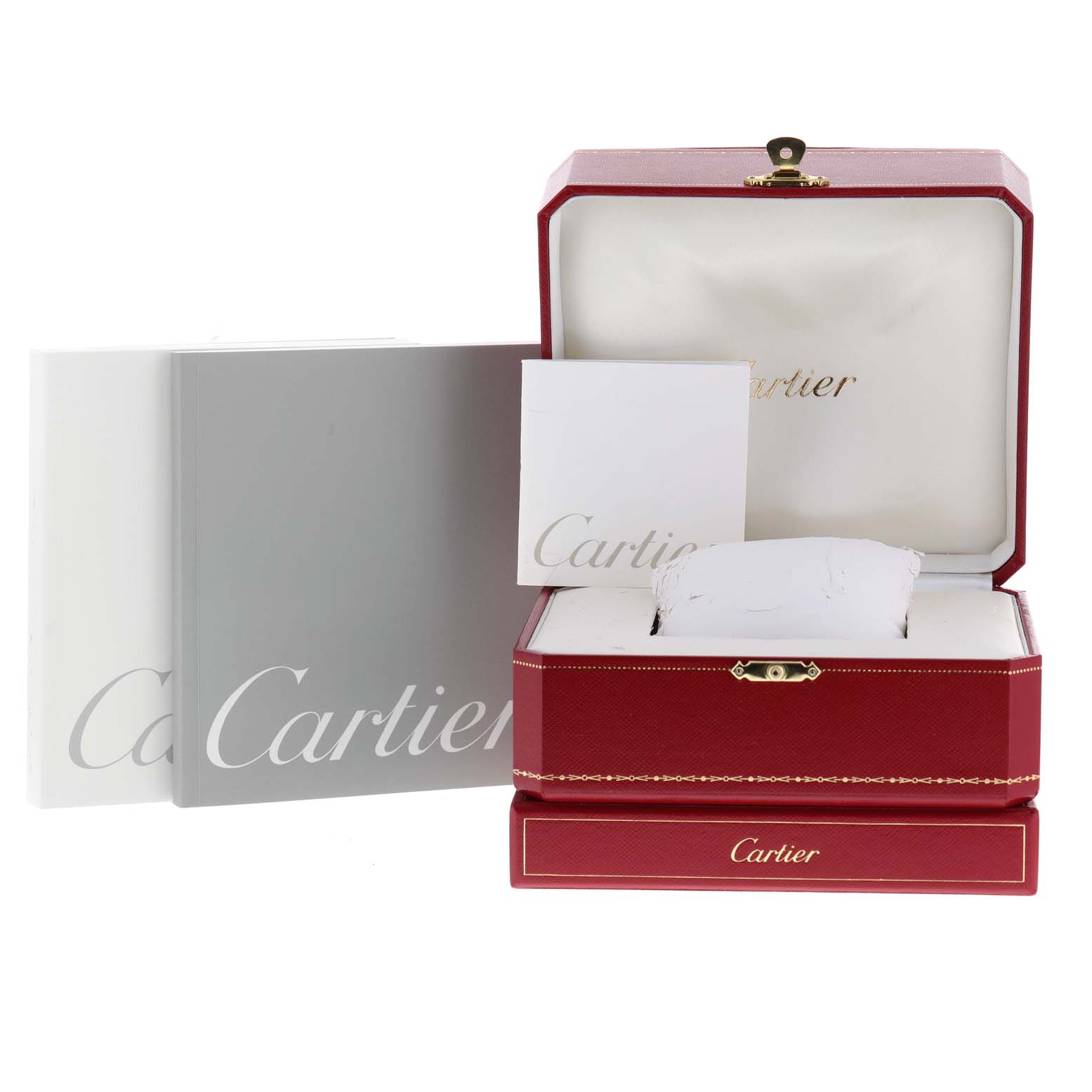The image shows packaging and manuals for a Cartier Roadster W62019X6 Men
s Stainless Steel Silver Dial W62019X6 Men
s Stainless Steel Silver Dial watch, including a red box and branded booklets.