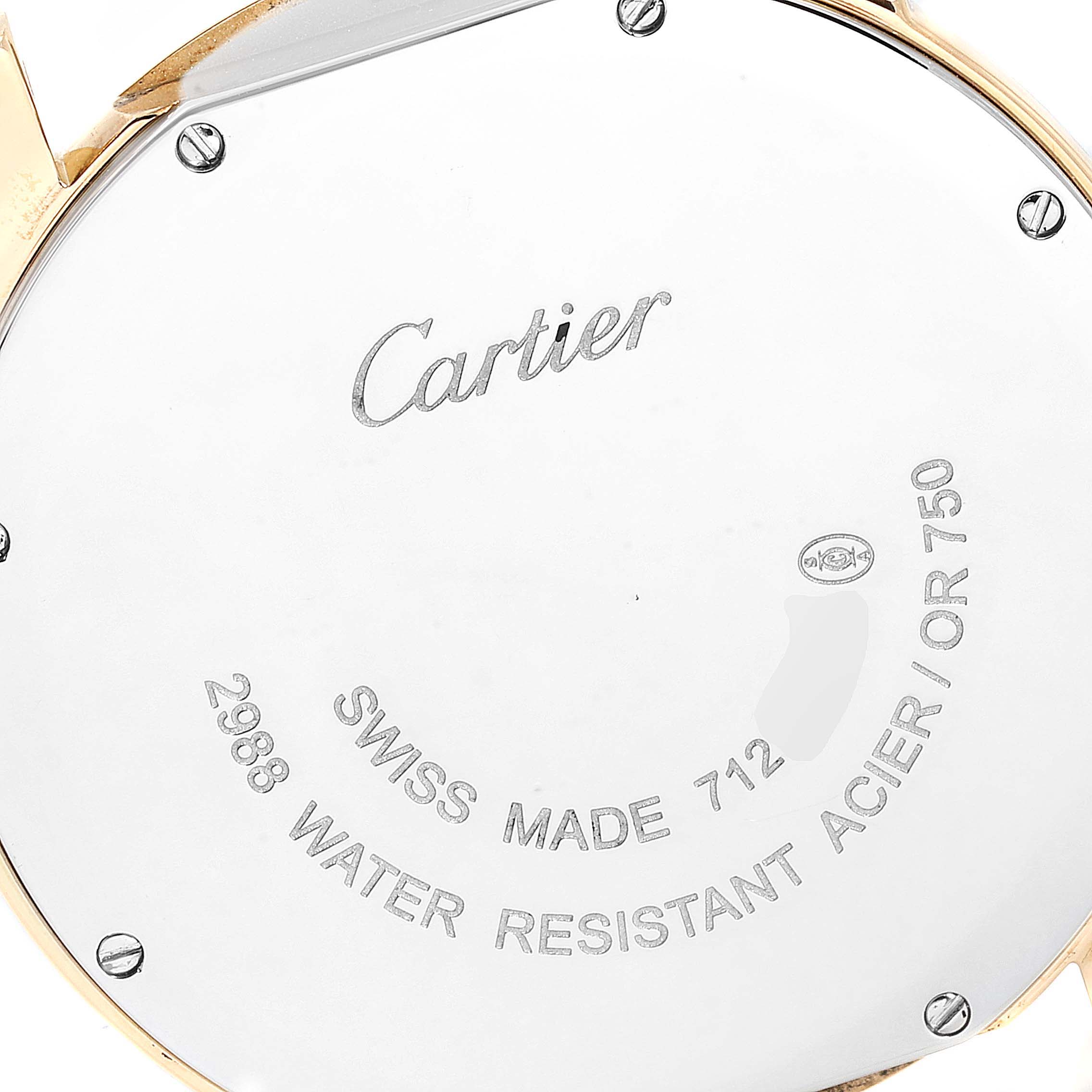 This image shows the back of a Cartier Ronde W6700455 Women
s Yellow Gold Silver Dial W6700455 Women
s Yellow Gold Silver Dial watch, highlighting the engravings and metal screws.