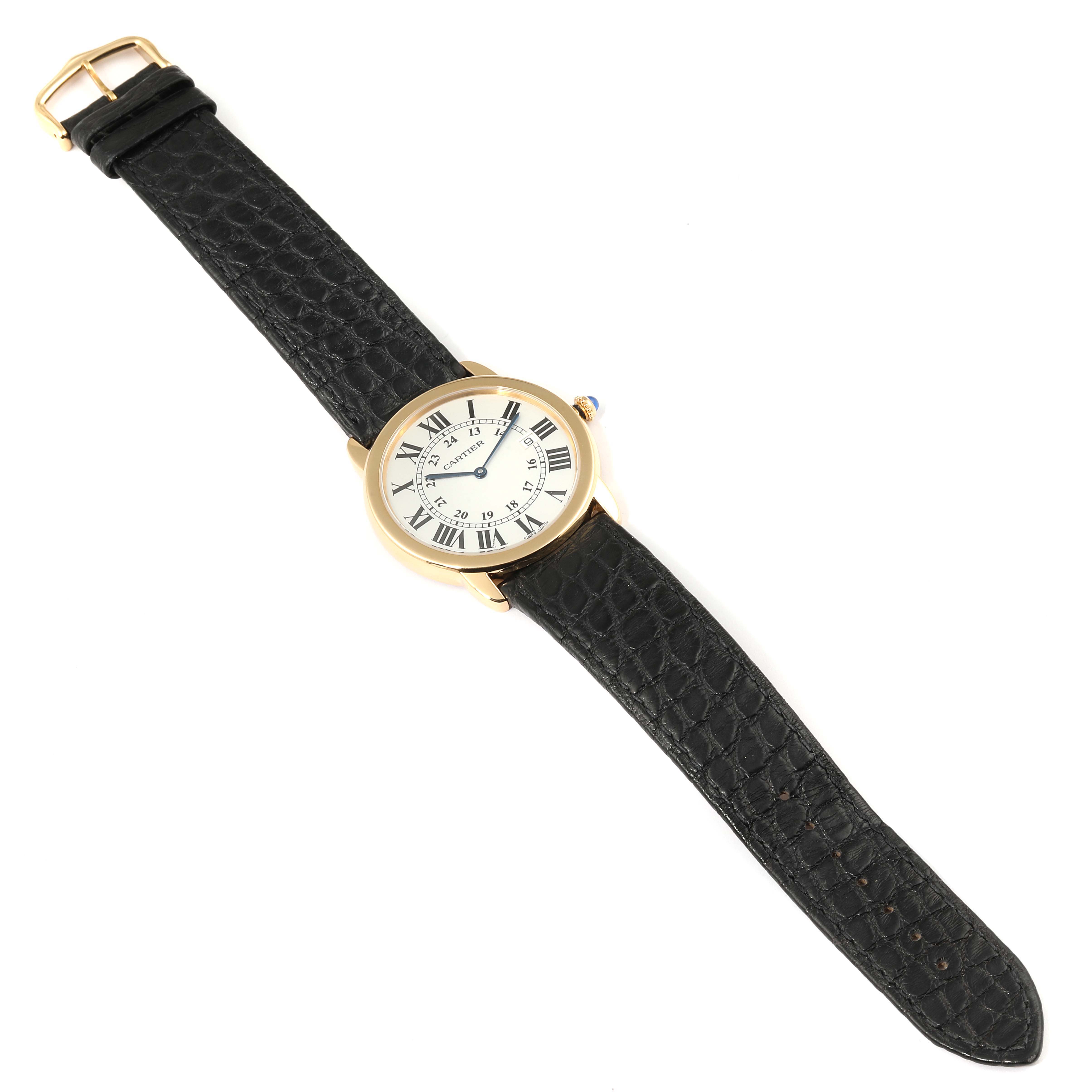 The image shows a Ronde model watch by Cartier from a top-down angle, displaying its face, black leather strap, and gold buckle.