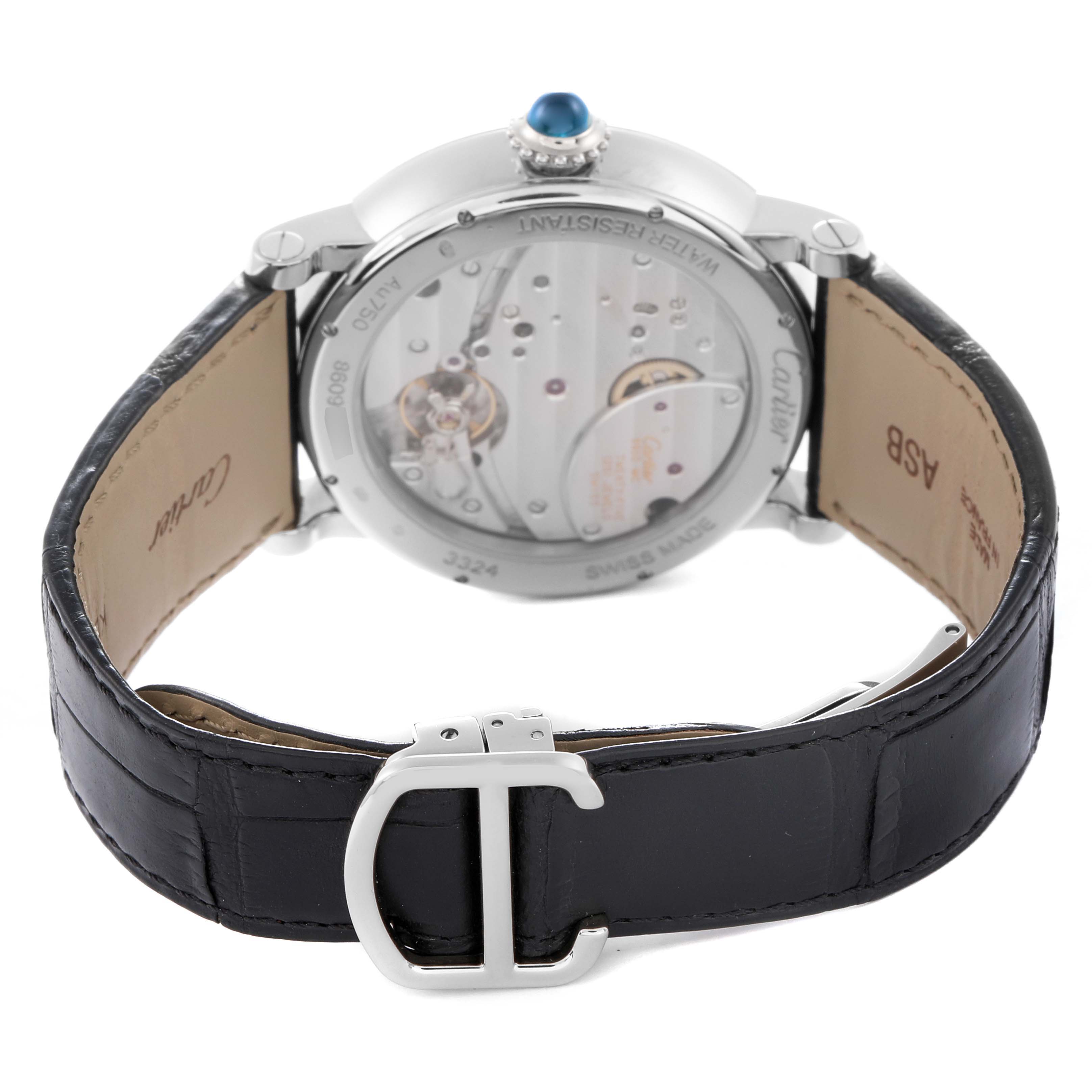 The image shows the back view of the Cartier Rotonde, model W1556202, featuring its transparent case back and a black leather strap with a clasp.