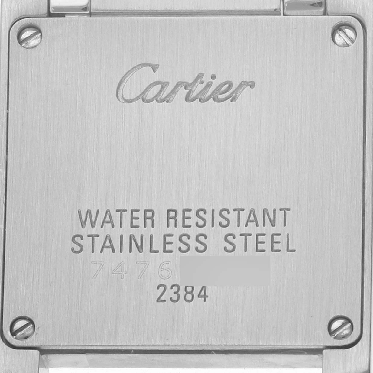 The image shows the backplate of a Cartier Tank Francaise W51007Q4 Women's Stainless Steel Pink Dial watch, highlighting its stainless steel and water-resistant features.