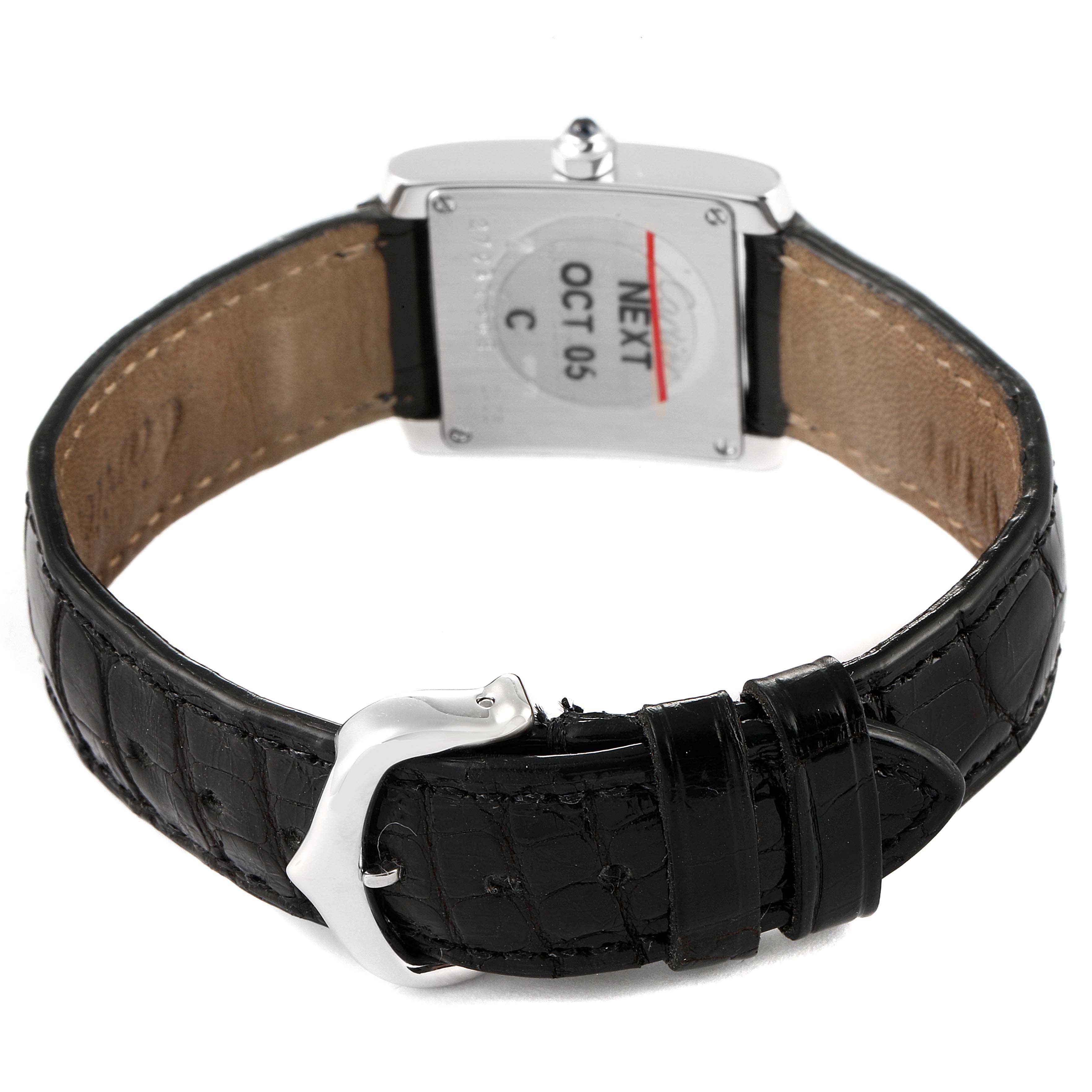 This image shows the back angle of a Cartier Tank Française watch, highlighting its leather strap and buckle.