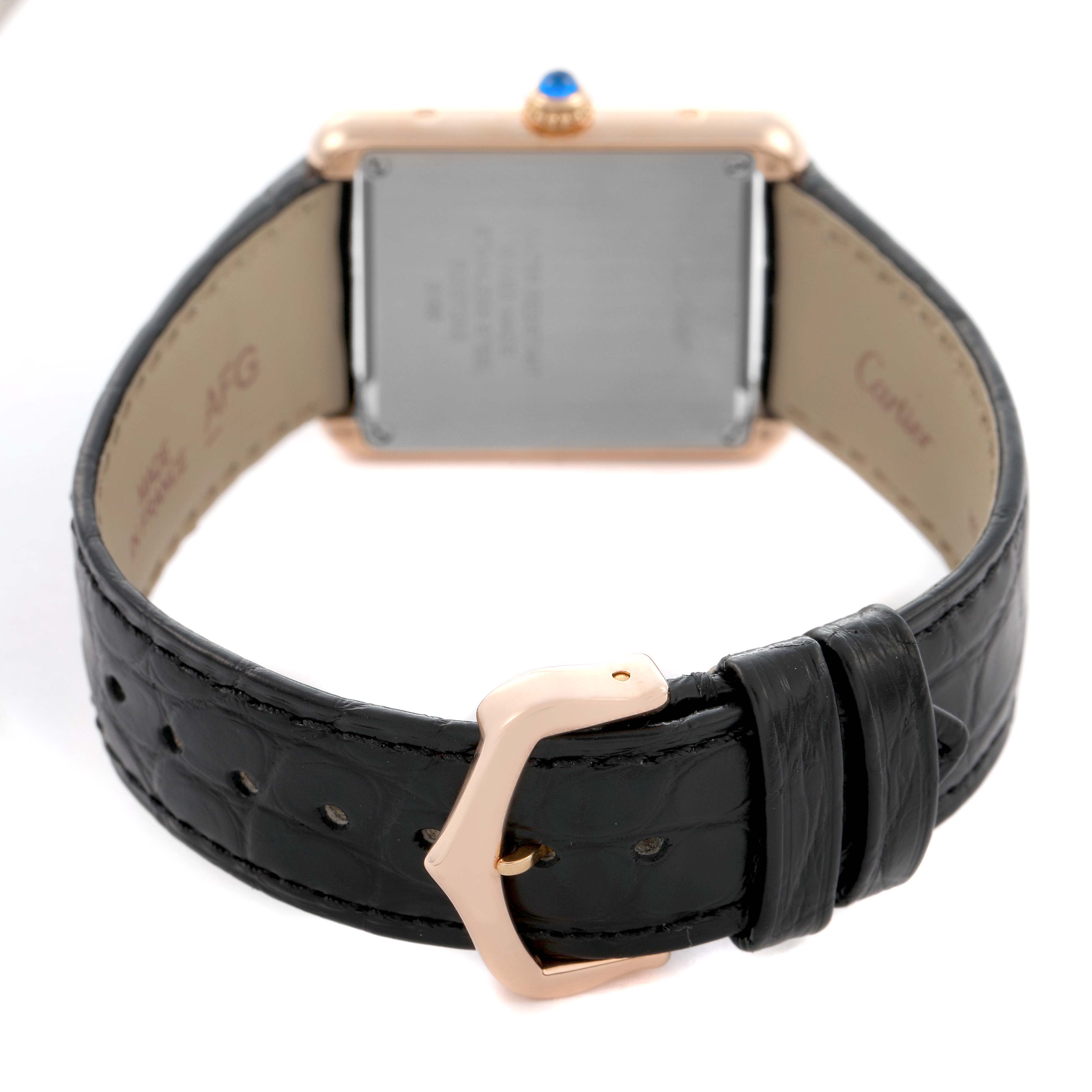 The Cartier Tank Solo W5200024 Women's Rose Gold Silver Dial watch is shown from the back, highlighting the leather strap and detailed buckle.