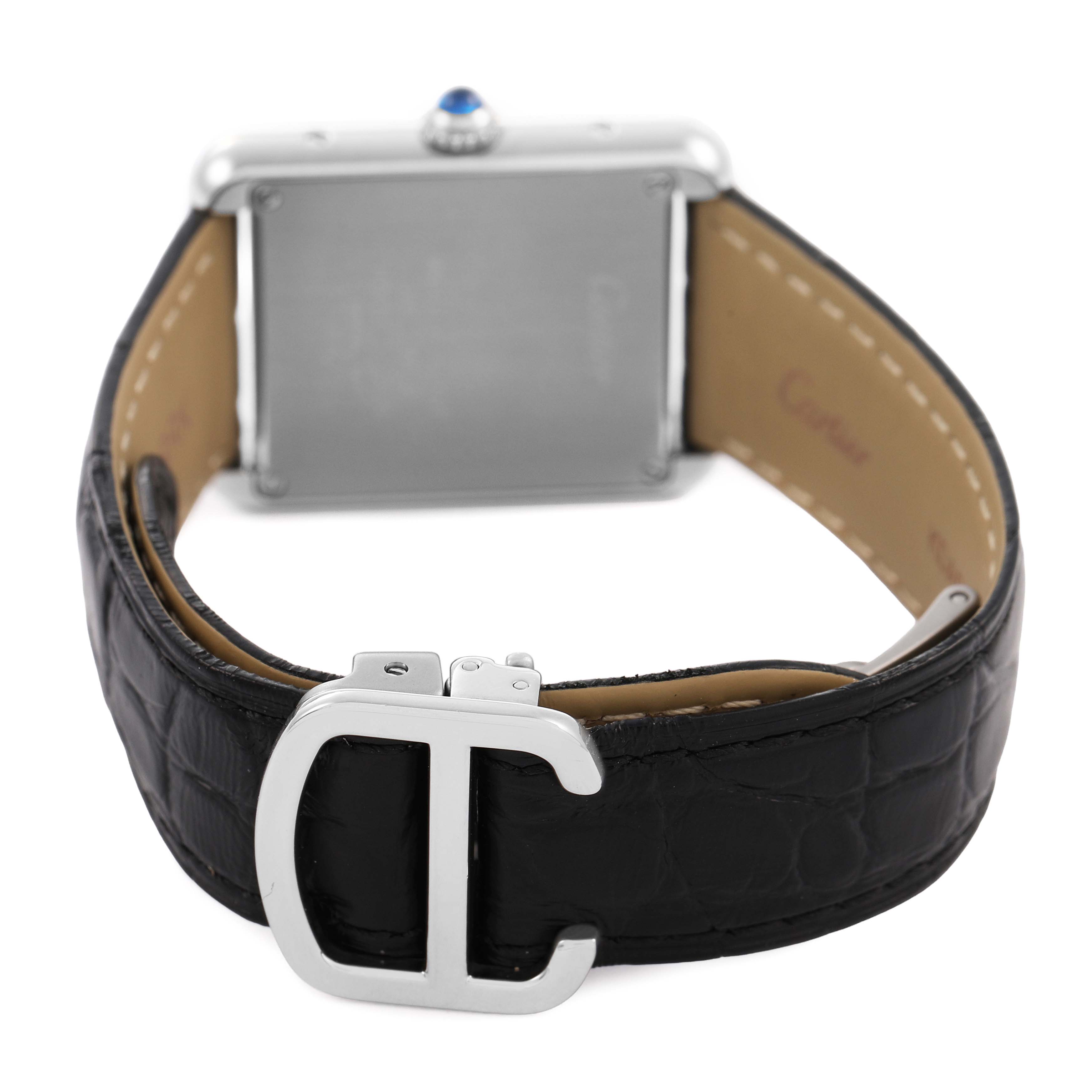 The image shows the back of a Cartier Tank Solo W1018255 Women's Stainless Steel Silver Dial watch, highlighting its black leather strap and metal buckle.