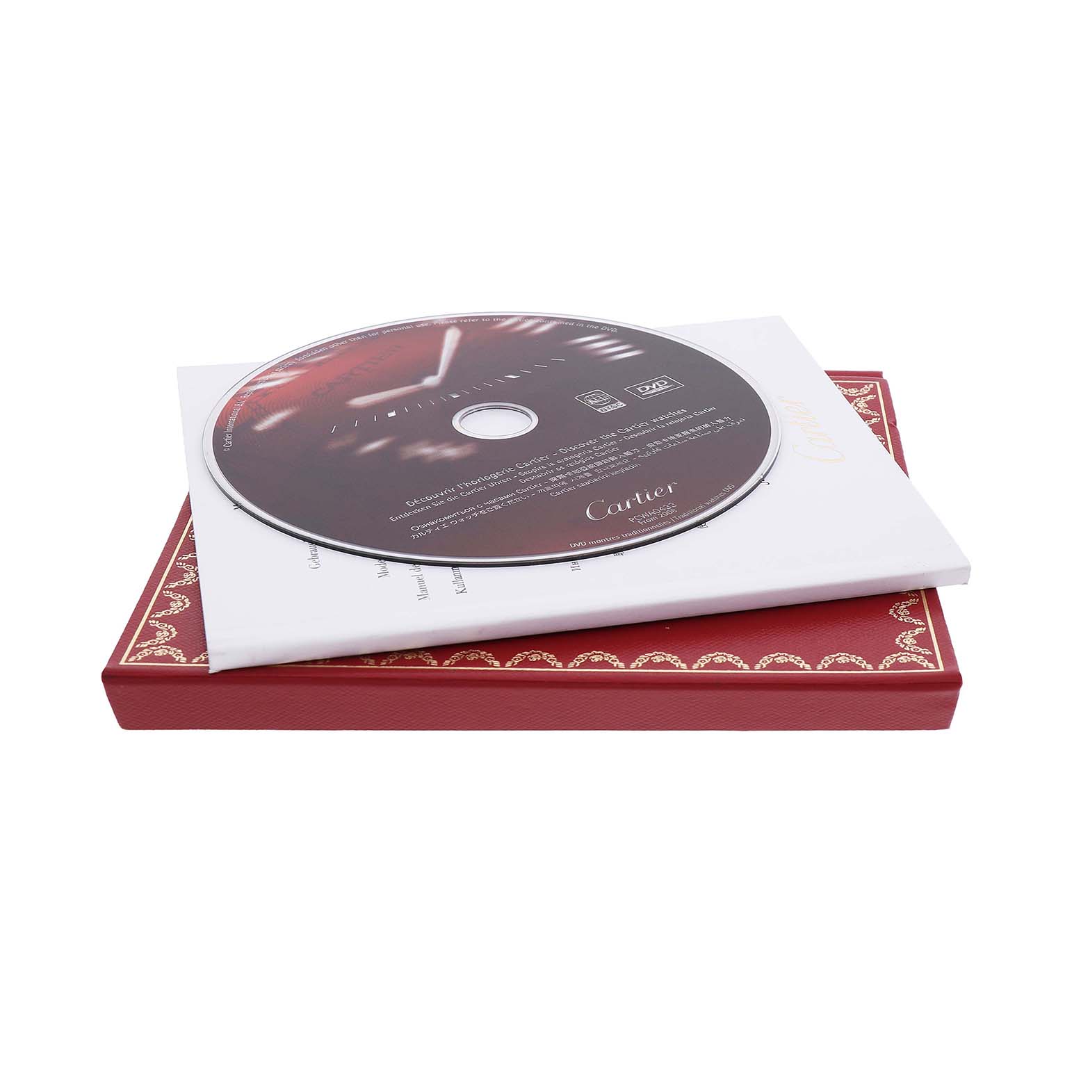 This image shows the Cartier Tank Solo W1018255 Women's Stainless Steel Silver Dial watch accessories, featuring a CD and a red box with decorative details.