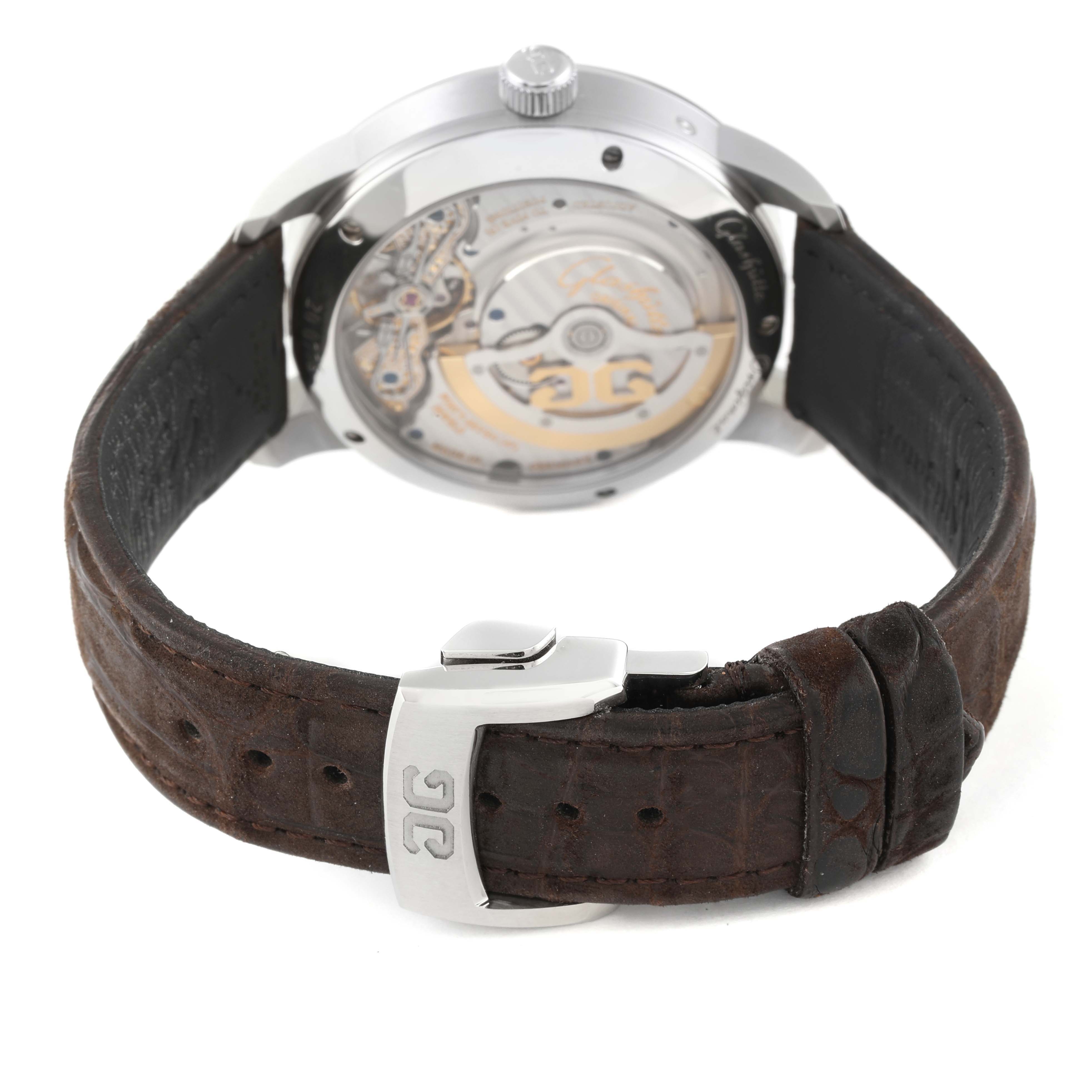 The image shows the back view of the Glashütte Pano model, highlighting its movement and brown leather strap.