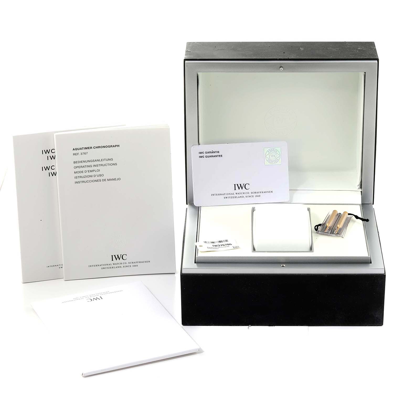 The image shows an IWC Aquatimer IW376706 Men's Stainless Steel Grey Dial IW376706 Men's Stainless Steel Grey Dial watch box, instructions, guarantee card, and strap changing tools.