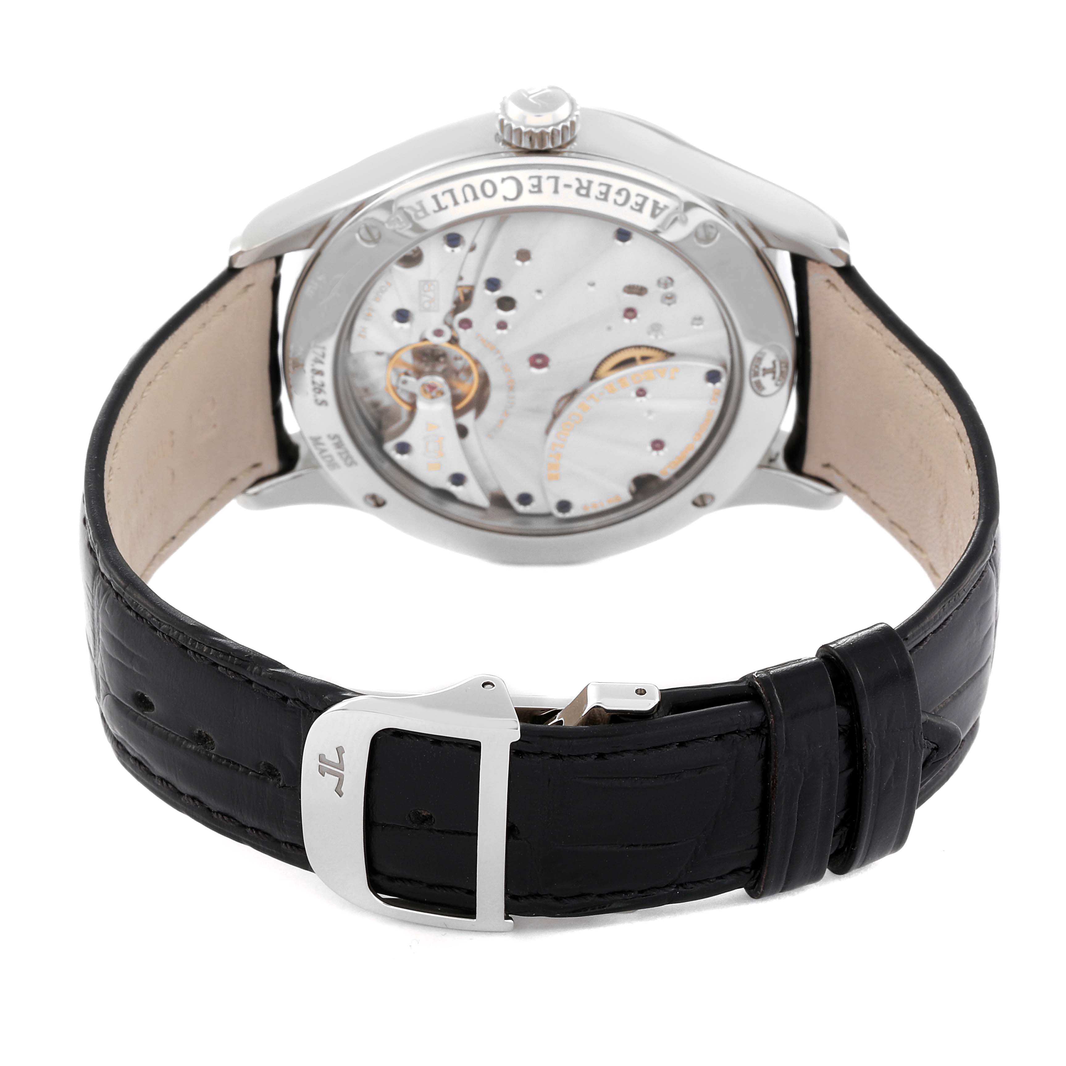 The image shows the back of a Jaeger-LeCoultre Master model watch, highlighting its mechanical movement and black leather strap.