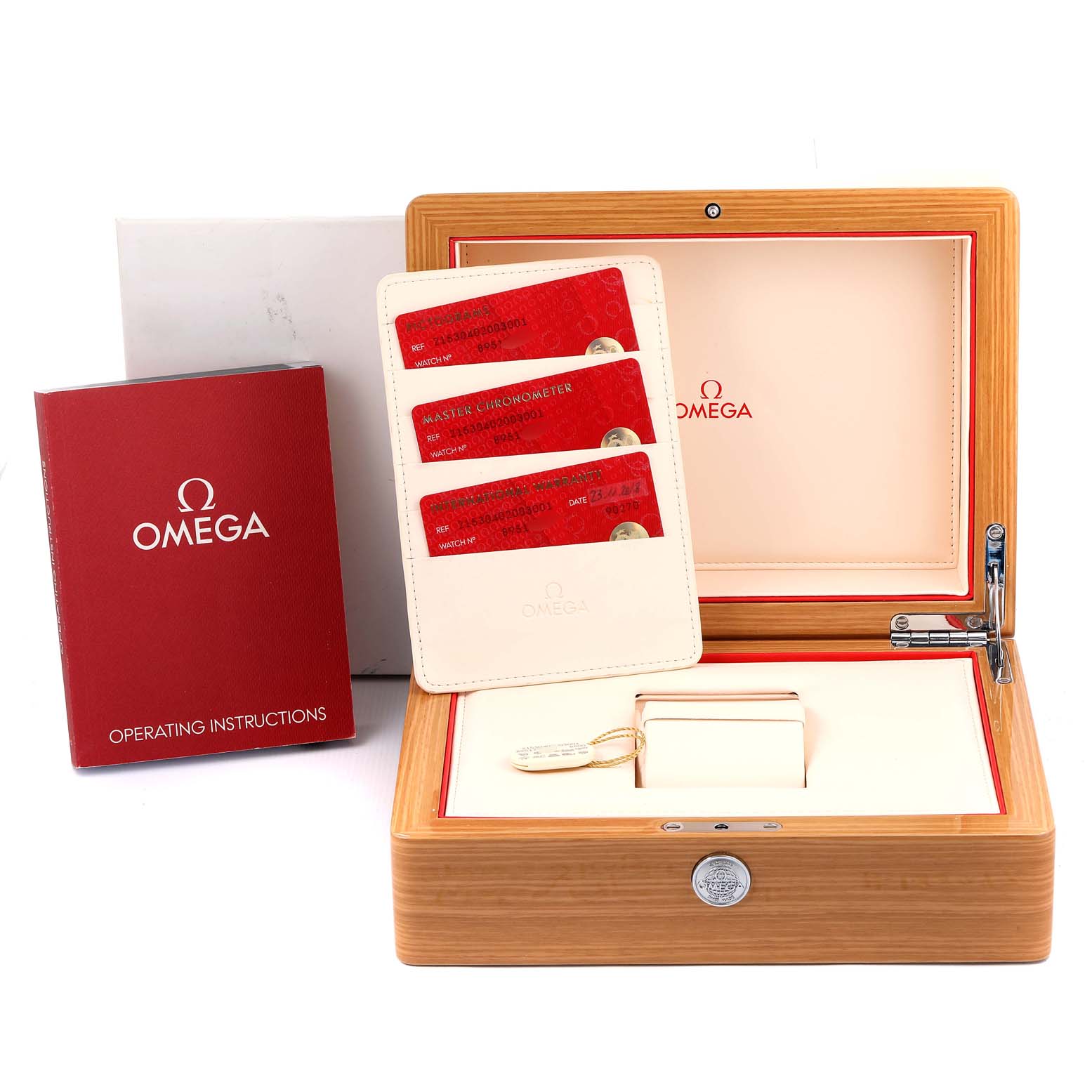 The image shows an Omega Planet Ocean 215.30.40.20.03.001 Men
s Stainless Steel Blue Dial 215.30.40.20.03.001 Men
s Stainless Steel Blue Dial watch box with operating instructions, warranty cards, and a key.