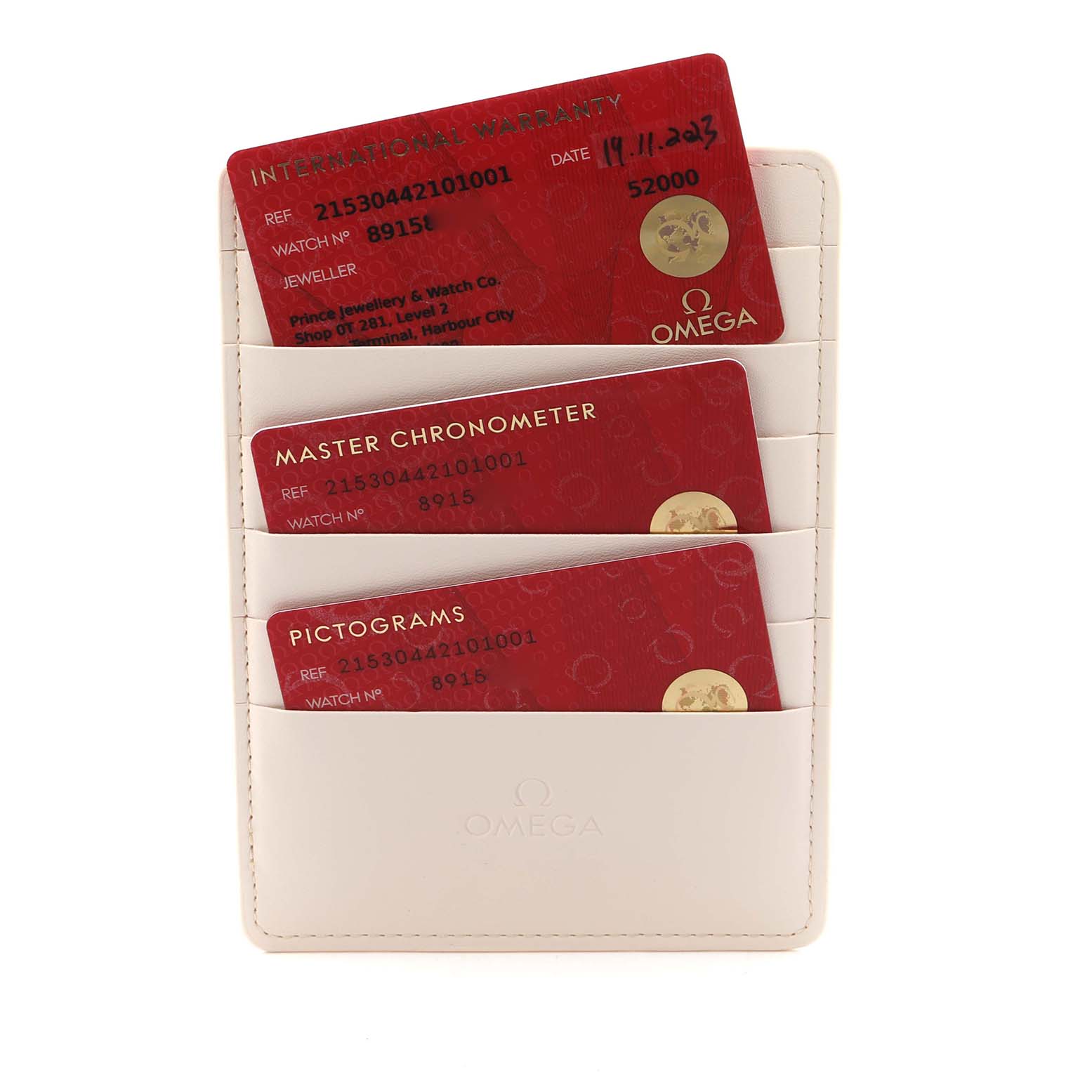 The image shows Omega Seamaster model 215.30.44.21.01.001 cards, including an international warranty, in a leather card holder.