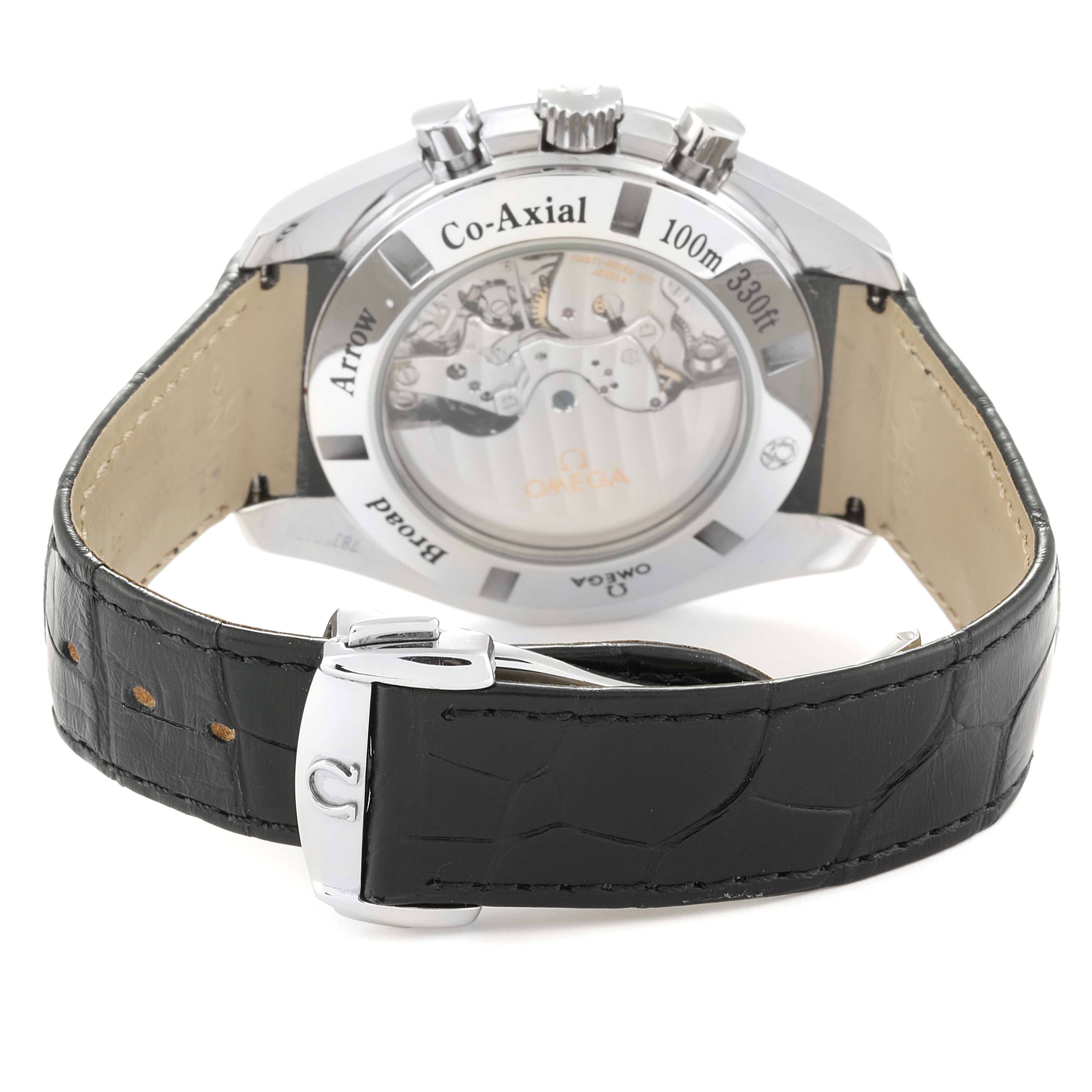 This Omega Speedmaster 321.13.44.50.02.001 Men's Stainless Steel Silver Dial 321.13.44.50.02.001 Men's Stainless Steel Silver Dial watch is shown from the back, highlighting its Co-Axial movement and leather strap with a clasp.