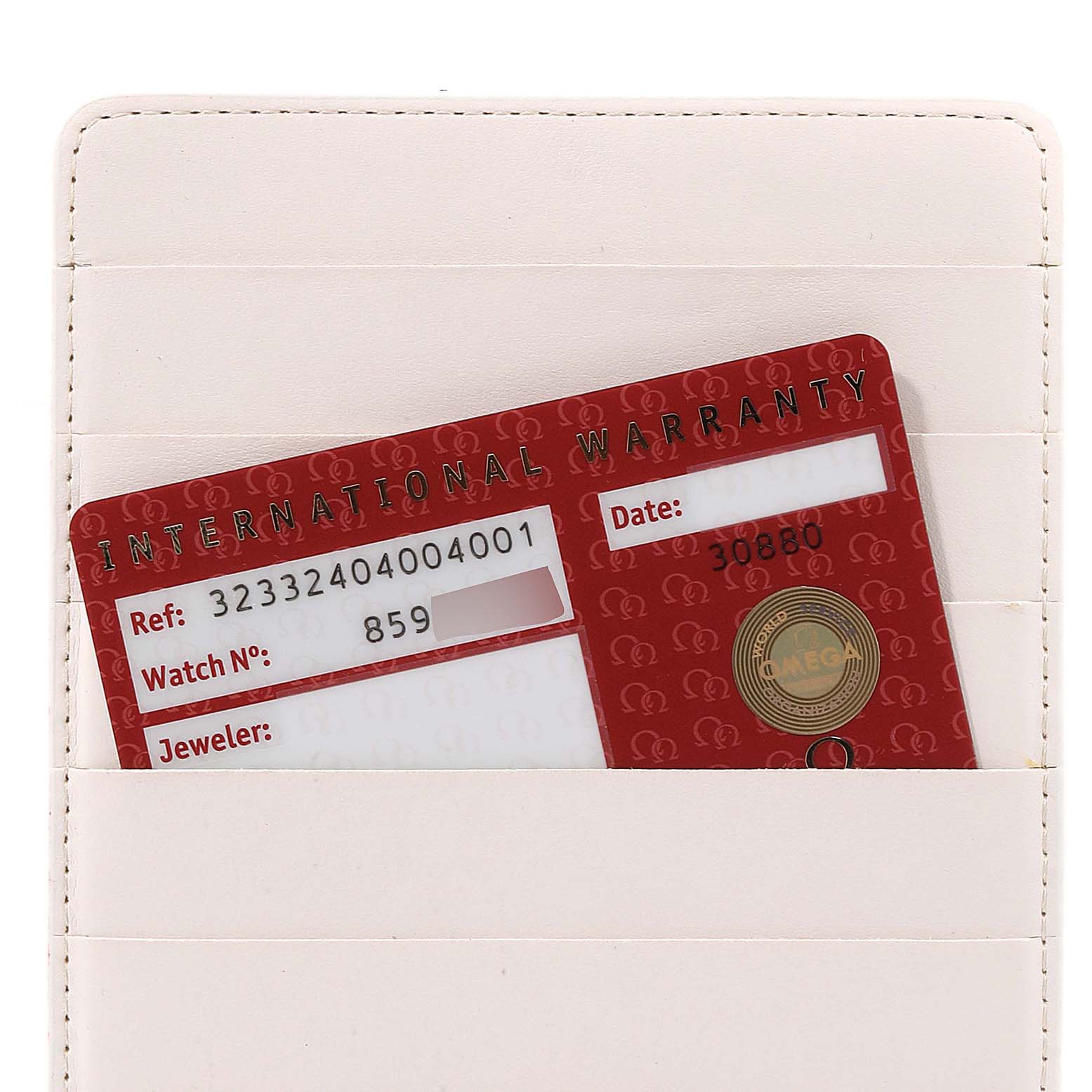 The image shows an international warranty card for an Omega Speedmaster 323.32.40.40.04.001 Men's Stainless Steel White Dial 323.32.40.40.04.001 Men's Stainless Steel White Dial watch, partially inserted in a white cardholder.