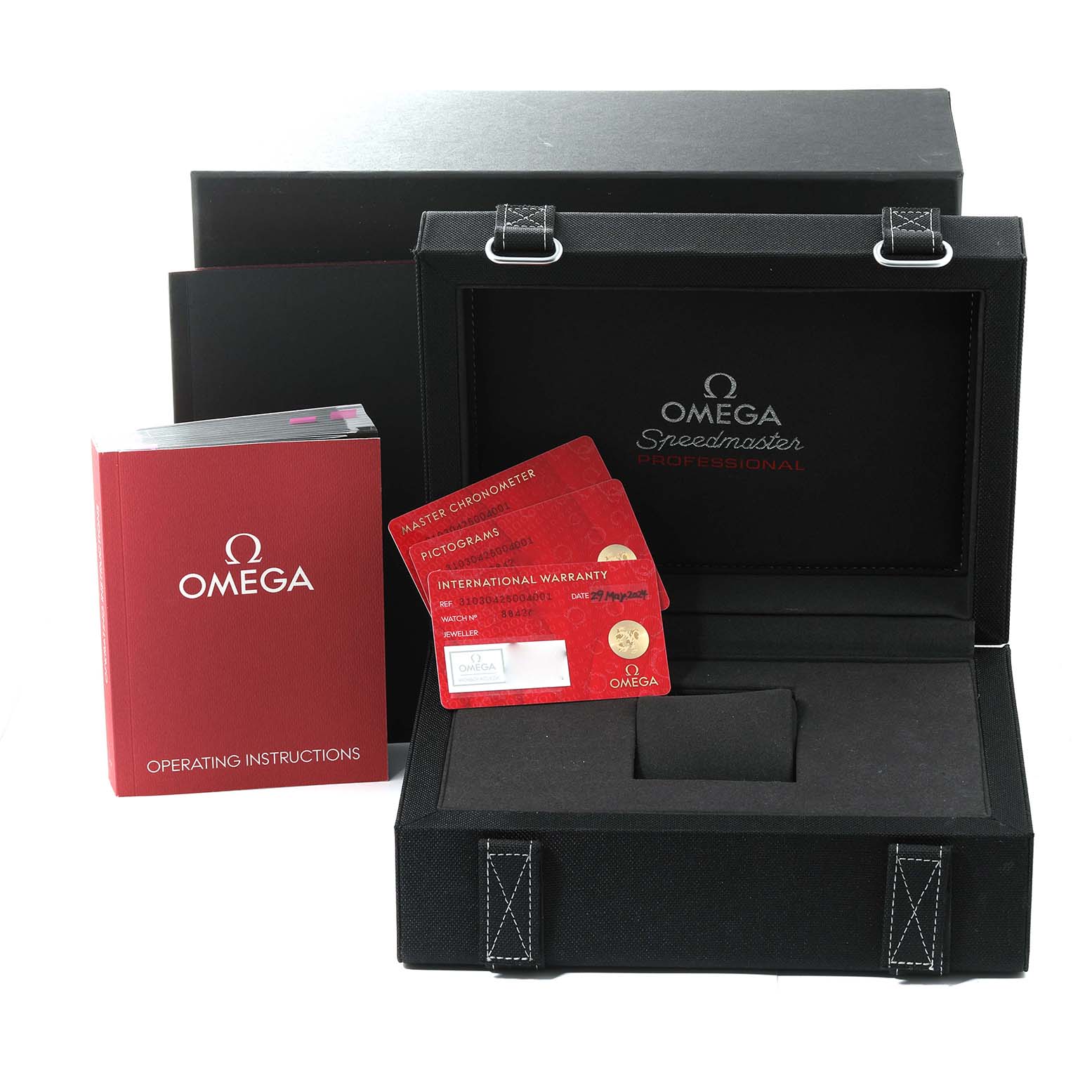 The image shows the Omega Speedmaster 310.30.42.50.04.001 Men
s Stainless Steel White Dial 310.30.42.50.04.001 Men
s Stainless Steel White Dial
s box, operating instructions, and warranty/pictogram cards.