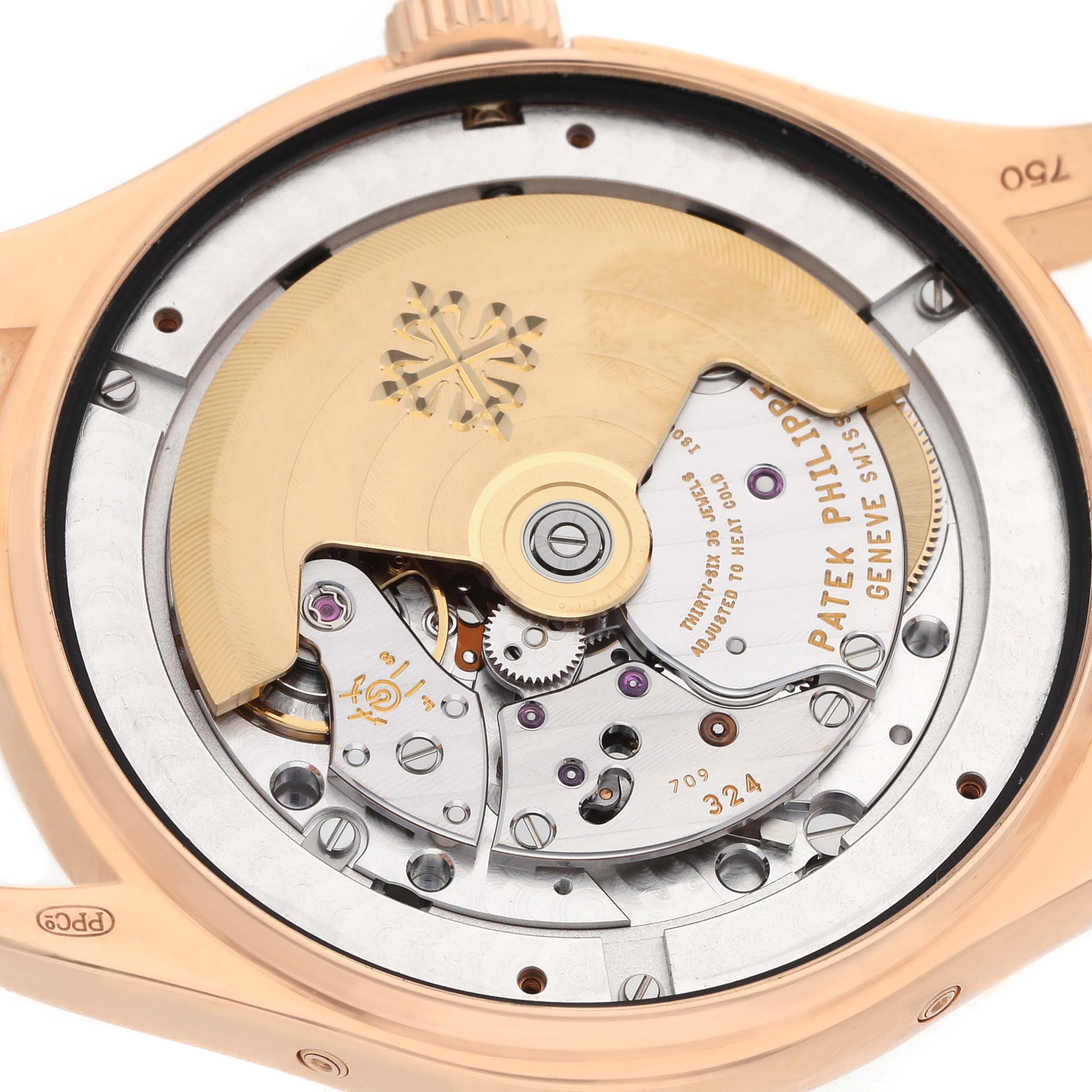 The image shows the back view of a Patek Philippe Complications Model 72689, revealing the intricate movement and rotor.