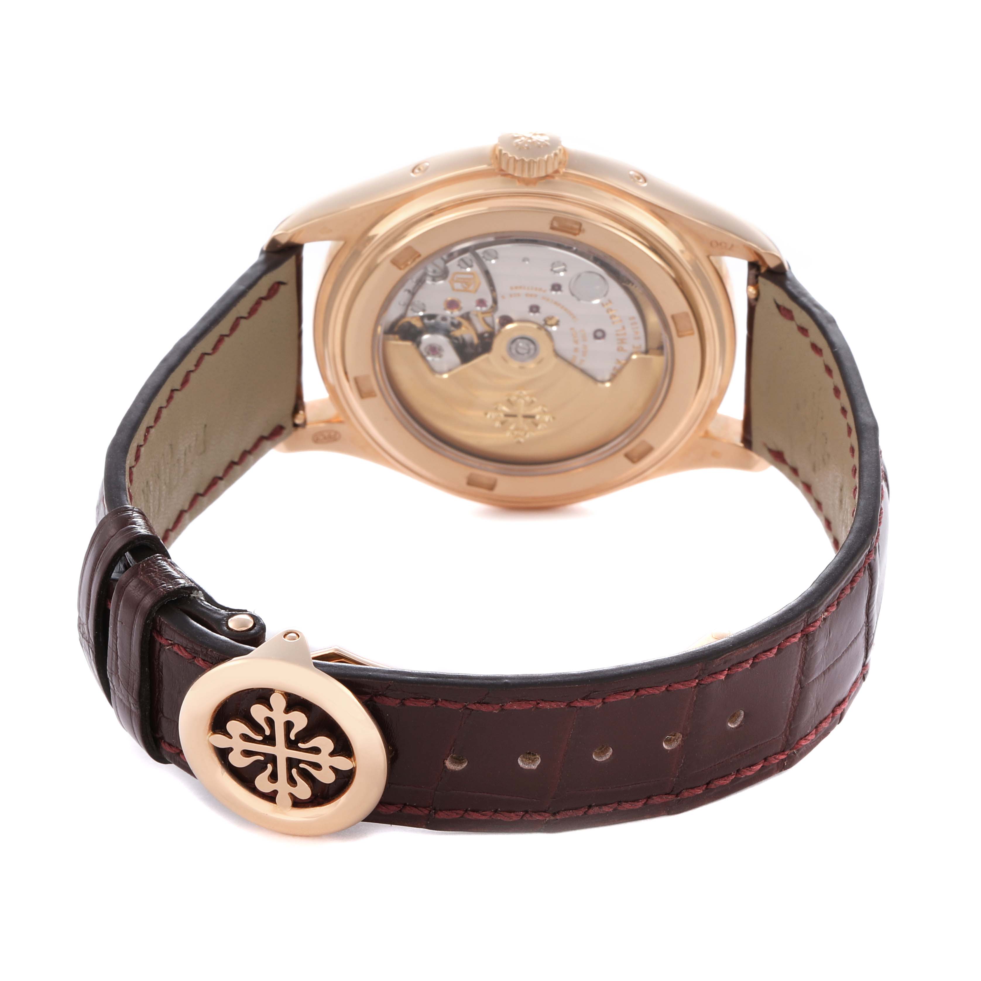 The image shows the back view of a Patek Philippe Complications model 72689 men
s watch, highlighting the movement and leather strap with a decorative clasp.