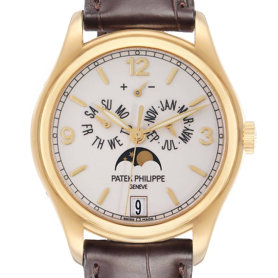 The image shows a frontal view of the Patek Philippe Complications model 5146J, highlighting its gold case, dial with calendar features, moon phase, and leather strap.