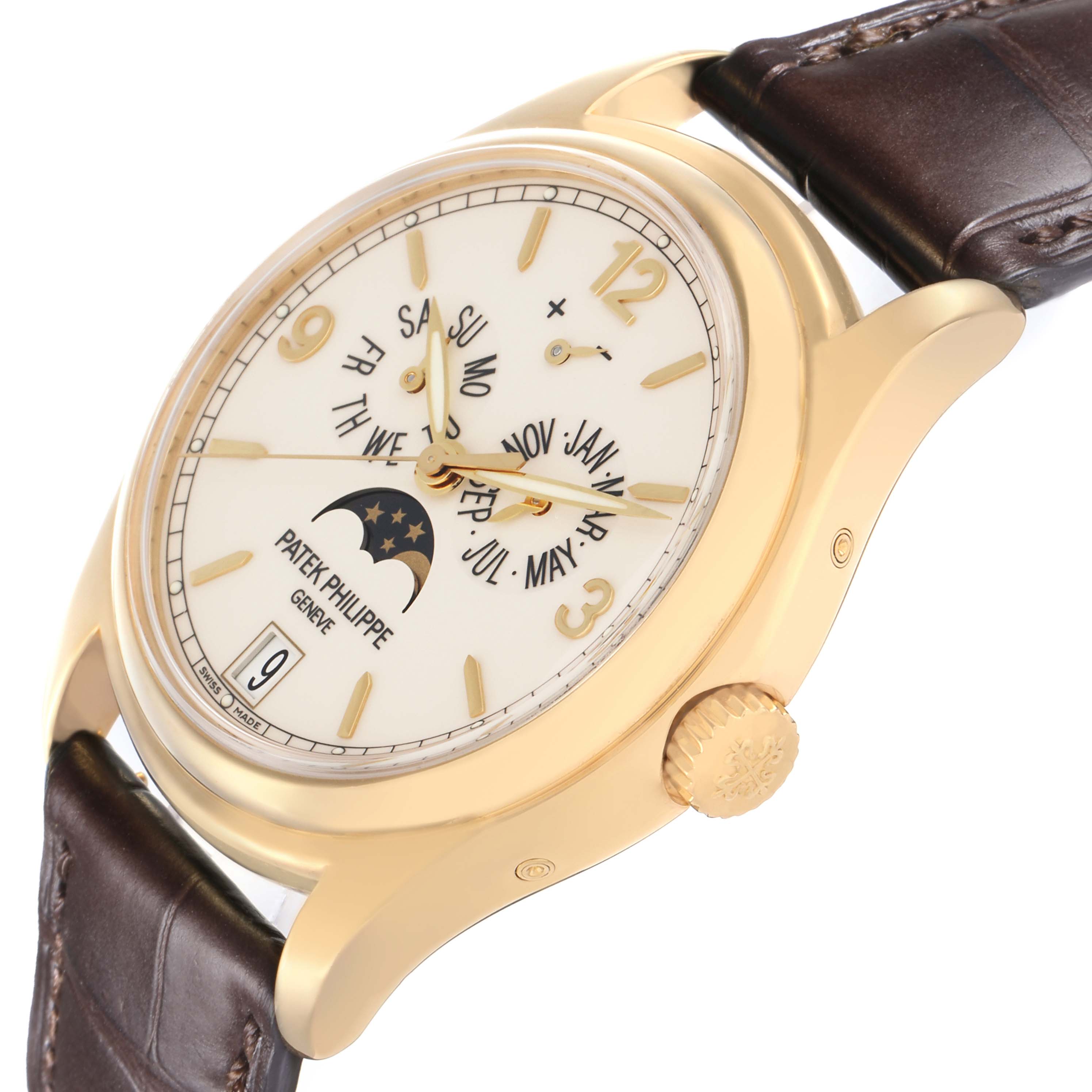 The Patek Philippe Complications 5146J is shown at a slight angle, displaying the gold case, crown, leather strap, and detailed dial with day, date, and moon phase.