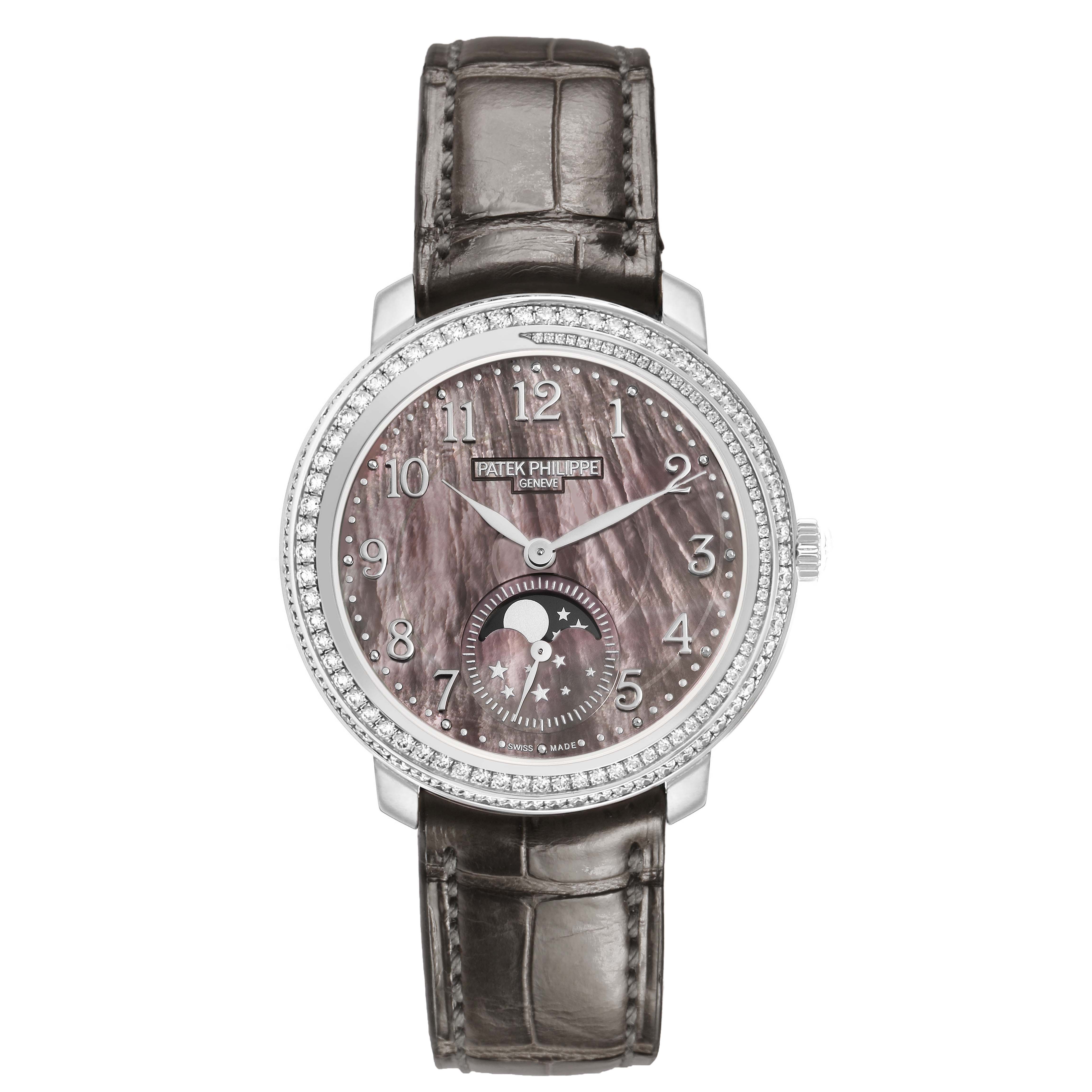 The Patek Philippe Complications 4968G Women's White Gold Mother of Pearl Dial watch is shown from a front angle, displaying its dial, moon phase, and leather strap.