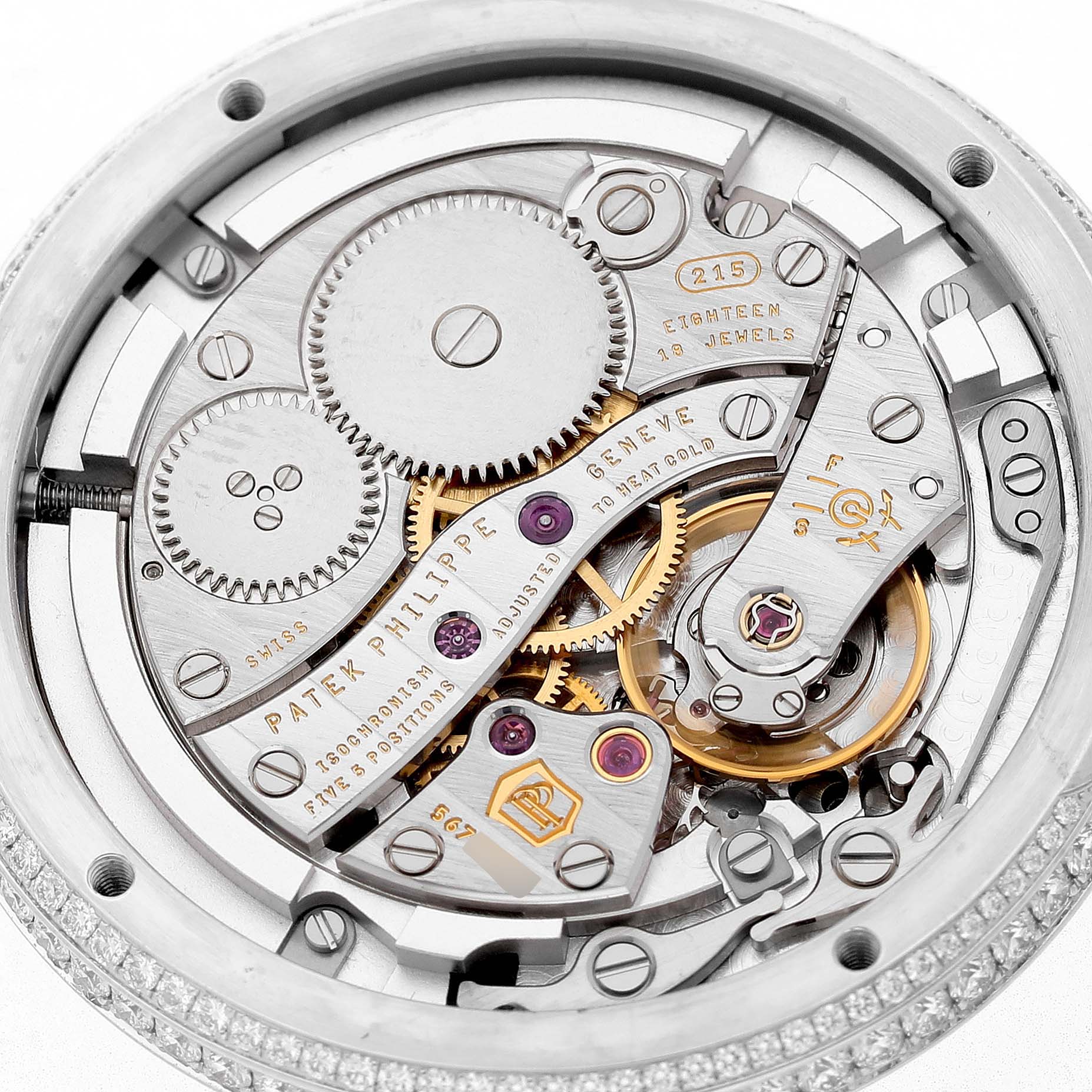 The image shows the intricate movement of a Patek Philippe Complications 4968G Women's White Gold Mother of Pearl Dial watch, highlighting gears and jewels from a back angle.