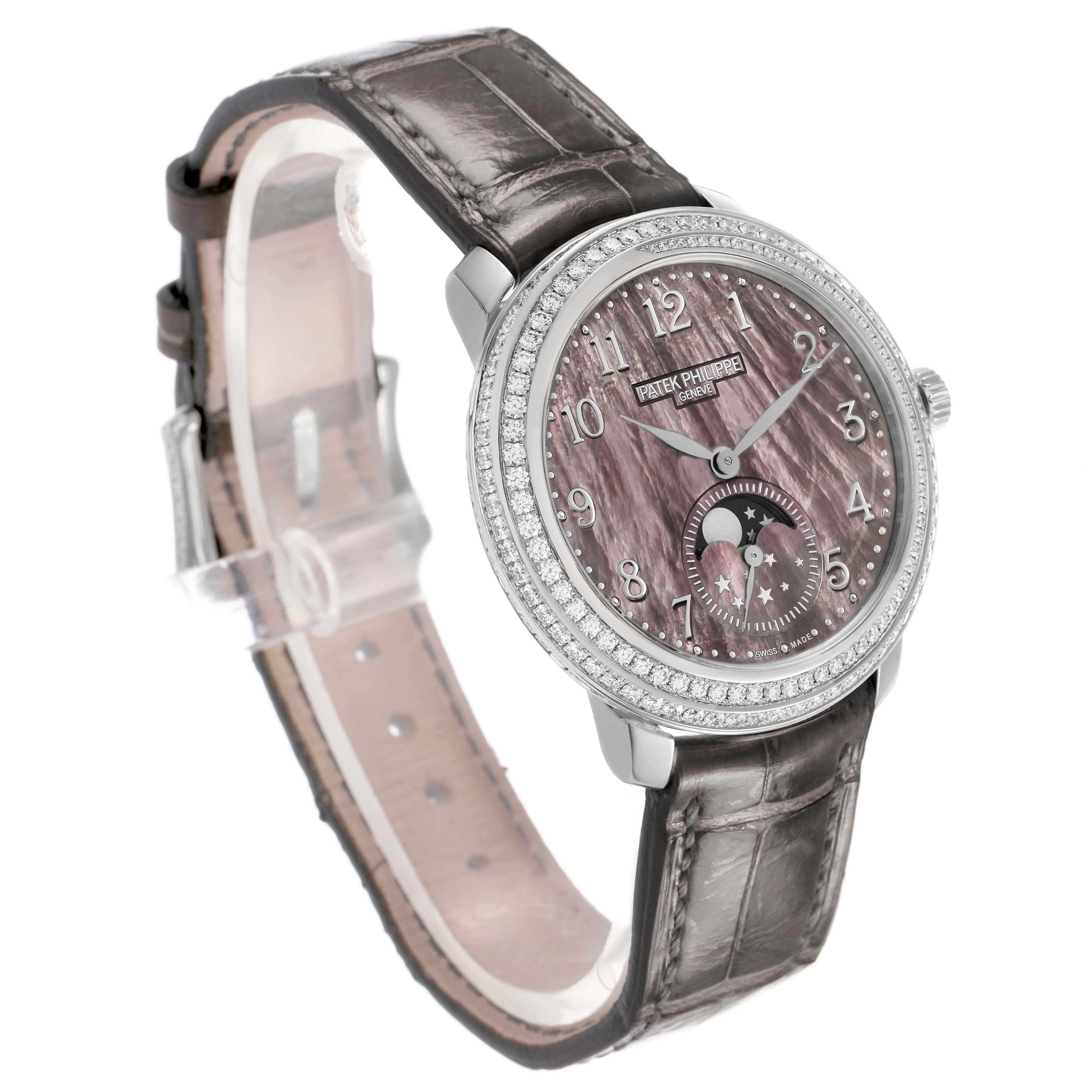 The Patek Philippe Complications 4968G Women's White Gold Mother of Pearl Dial watch is shown at a three-quarter angle, highlighting the dial, bezel, and leather strap.