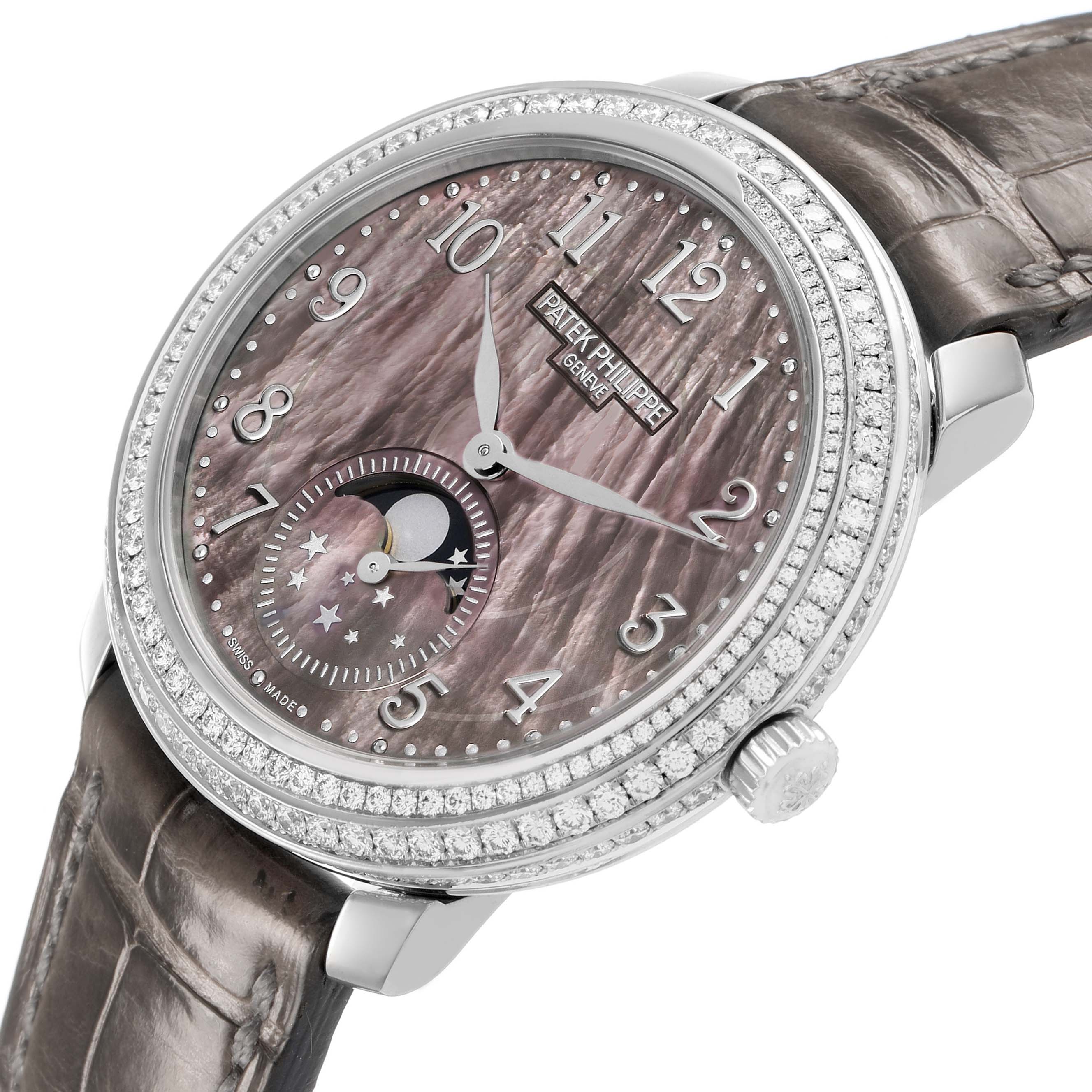 The Patek Philippe Complications 4968G Women's White Gold Mother of Pearl Dial watch is shown from an angled view, highlighting the dial, bezel, moon phase subdial, and strap.