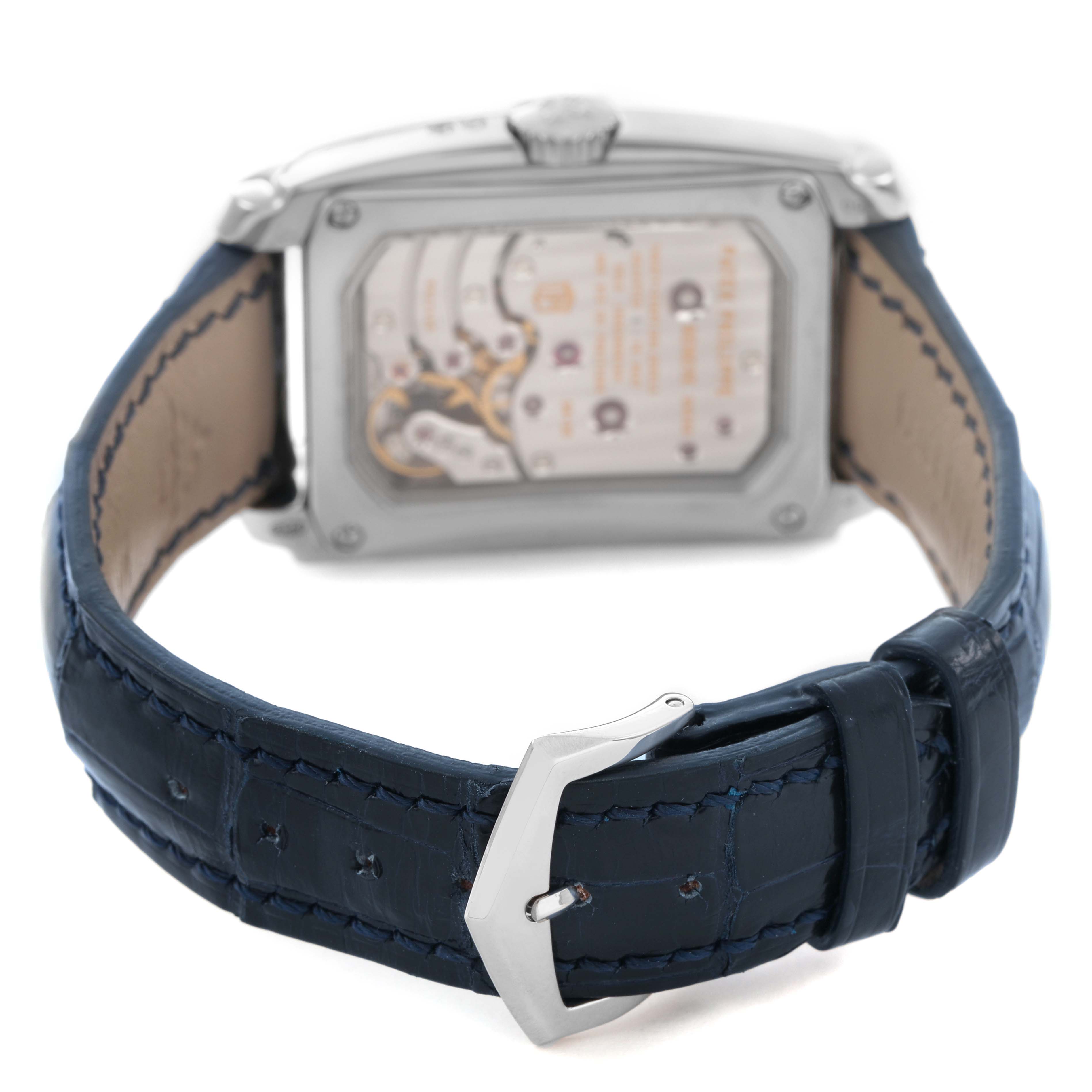 The image shows the back of a Patek Philippe Gondolo 5200 Men's White Gold Blue Dial watch, highlighting the movement and a blue leather strap with a buckle.
