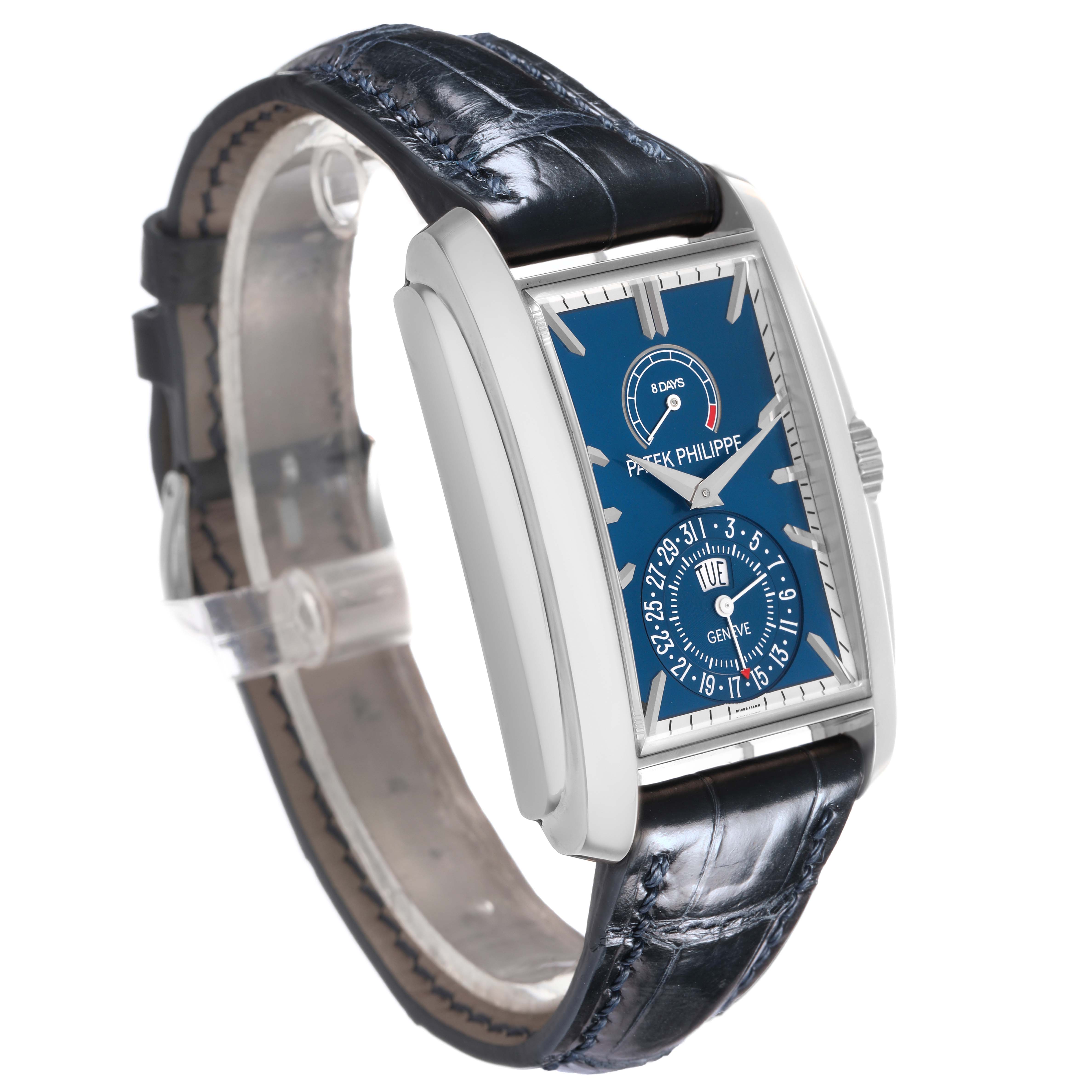 The Patek Philippe Gondolo 5200 Men's White Gold Blue Dial watch is shown at a three-quarter angle, displaying the blue dial and its side profile with a leather strap.