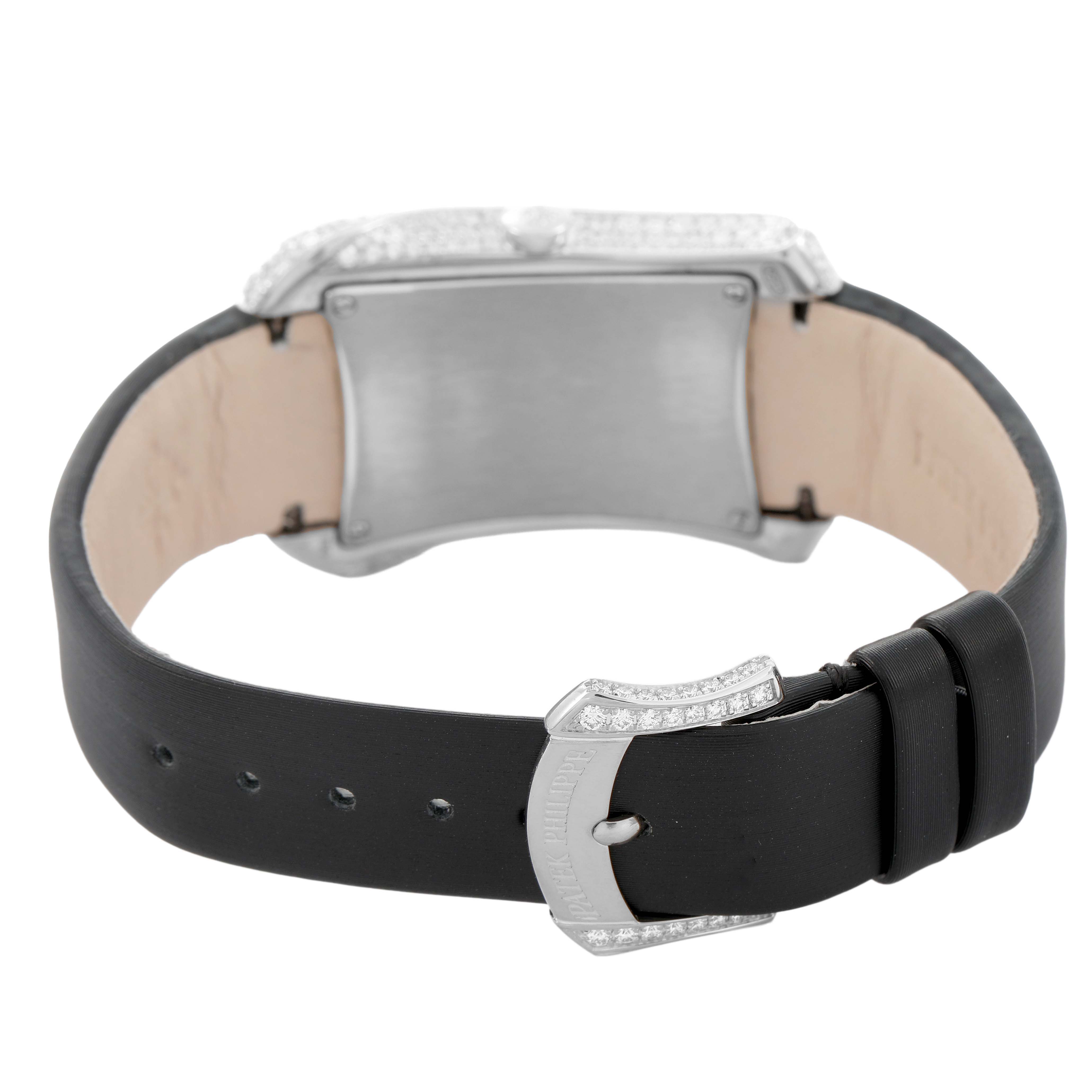 The Patek Philippe Gondolo 4973G Women's White Gold Mother of Pearl Dial watch is shown from the rear, highlighting the clasp, leather strap, and back of the case.
