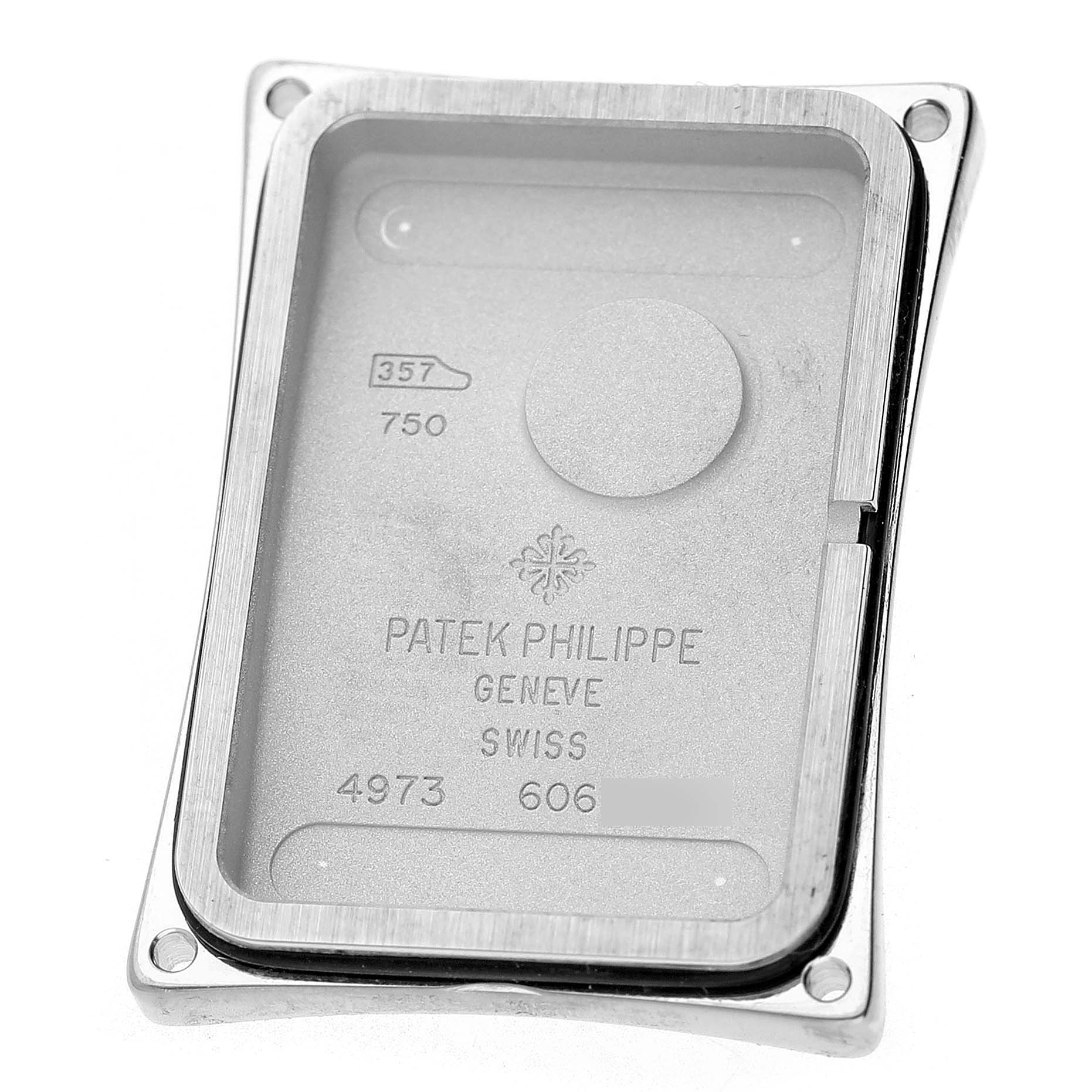 The image shows the back casing of a Patek Philippe Gondolo 4973G Women's White Gold Mother of Pearl Dial watch, highlighting its engraved branding and serial numbers.