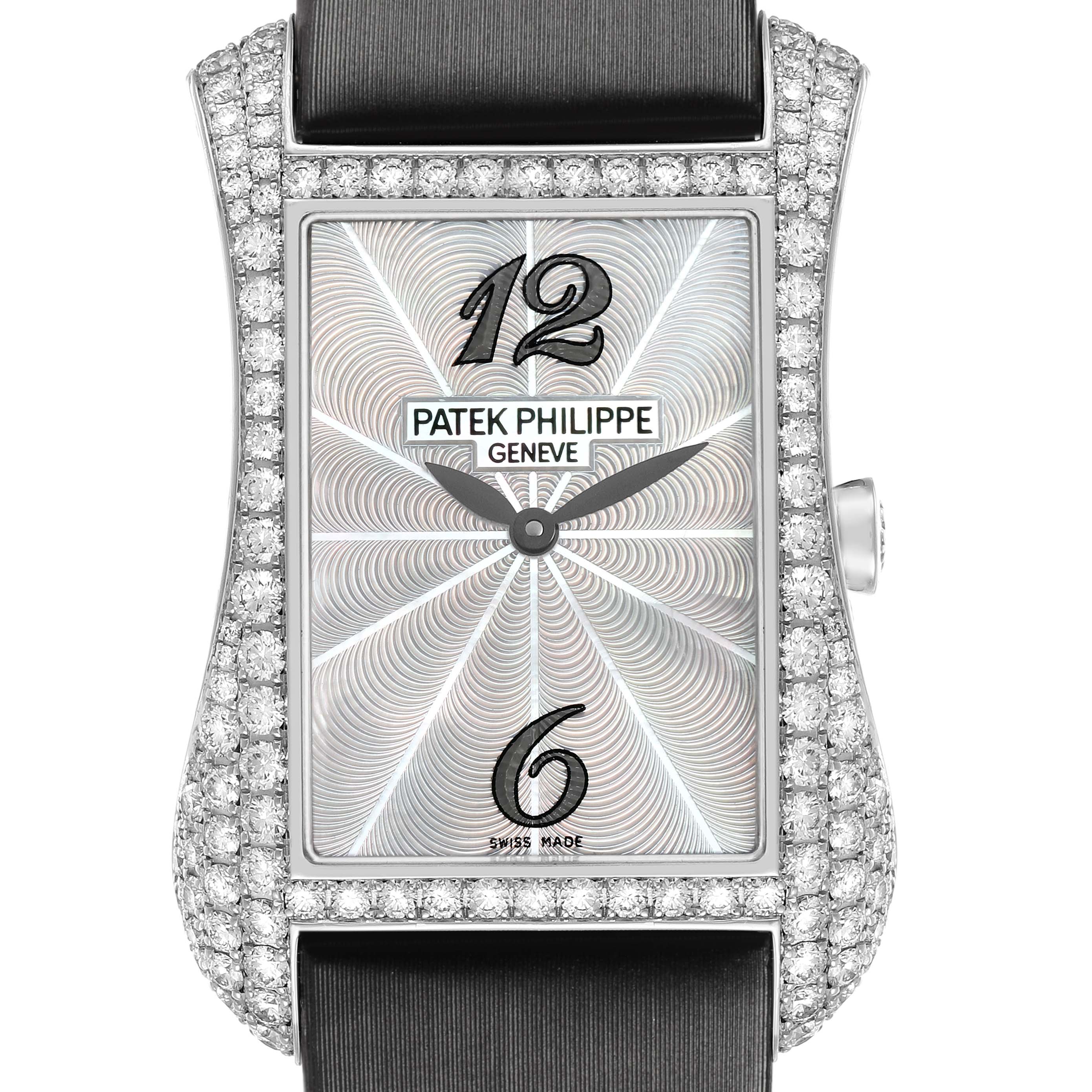 The Patek Philippe Gondolo 4973G Women's White Gold Mother of Pearl Dial watch is shown from a front angle, highlighting its rectangular diamond-studded case and dial details.