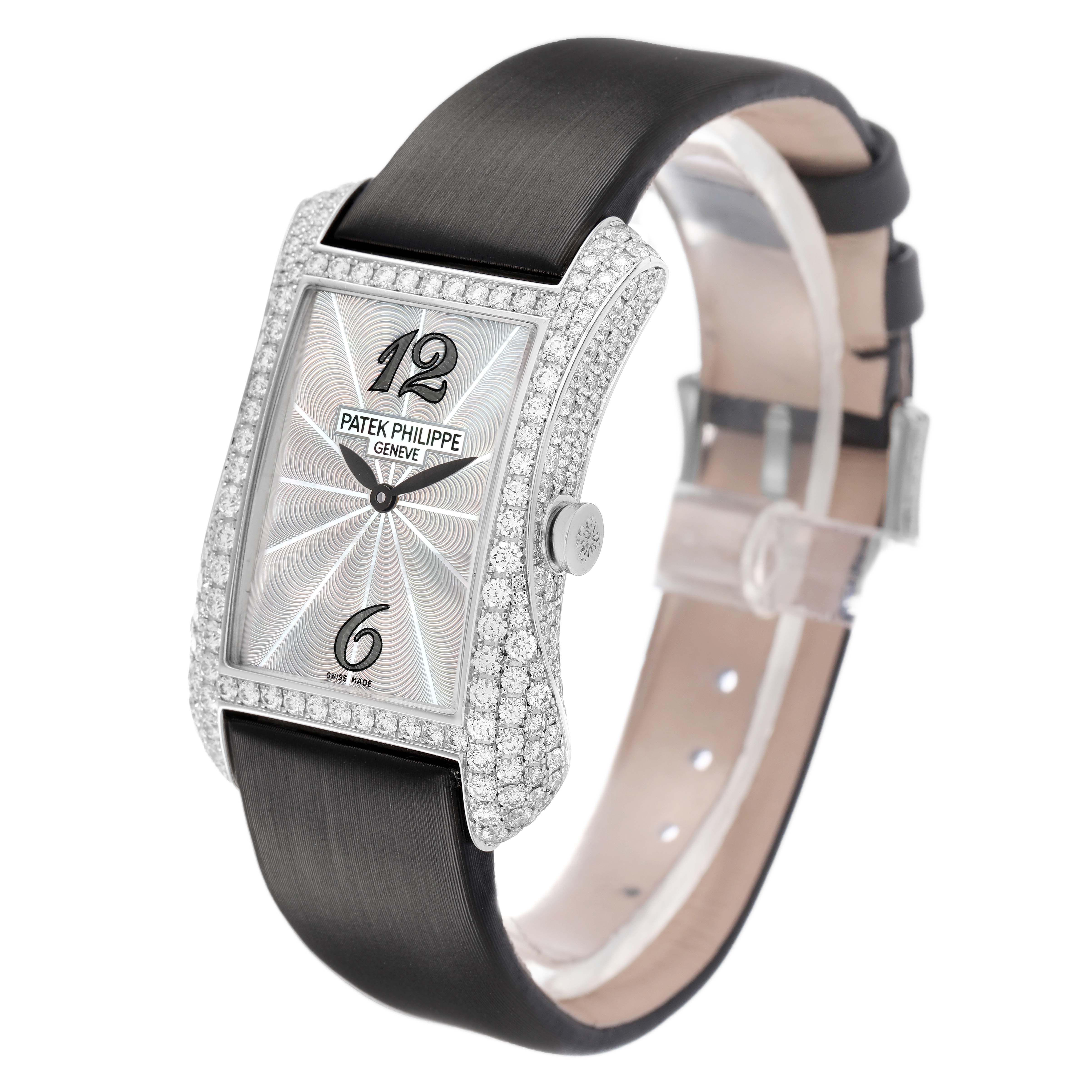 The Patek Philippe Gondolo 4973G Women's White Gold Mother of Pearl Dial watch is shown at an angle highlighting its diamond-encrusted case, dial, and leather strap.