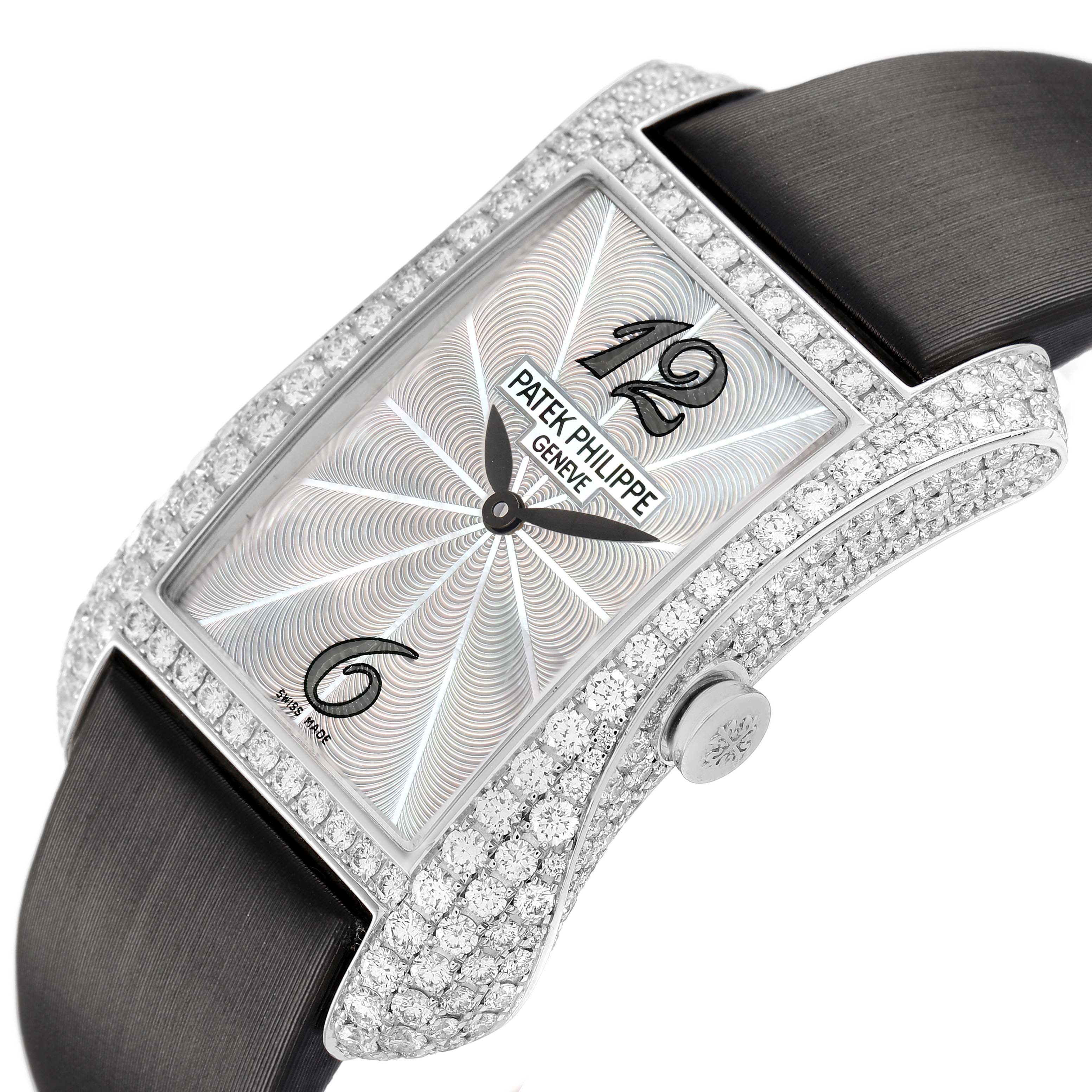 The Patek Philippe Gondolo 4973G Women's White Gold Mother of Pearl Dial watch is shown at an angle highlighting the diamond-encrusted case, dial, and crown.