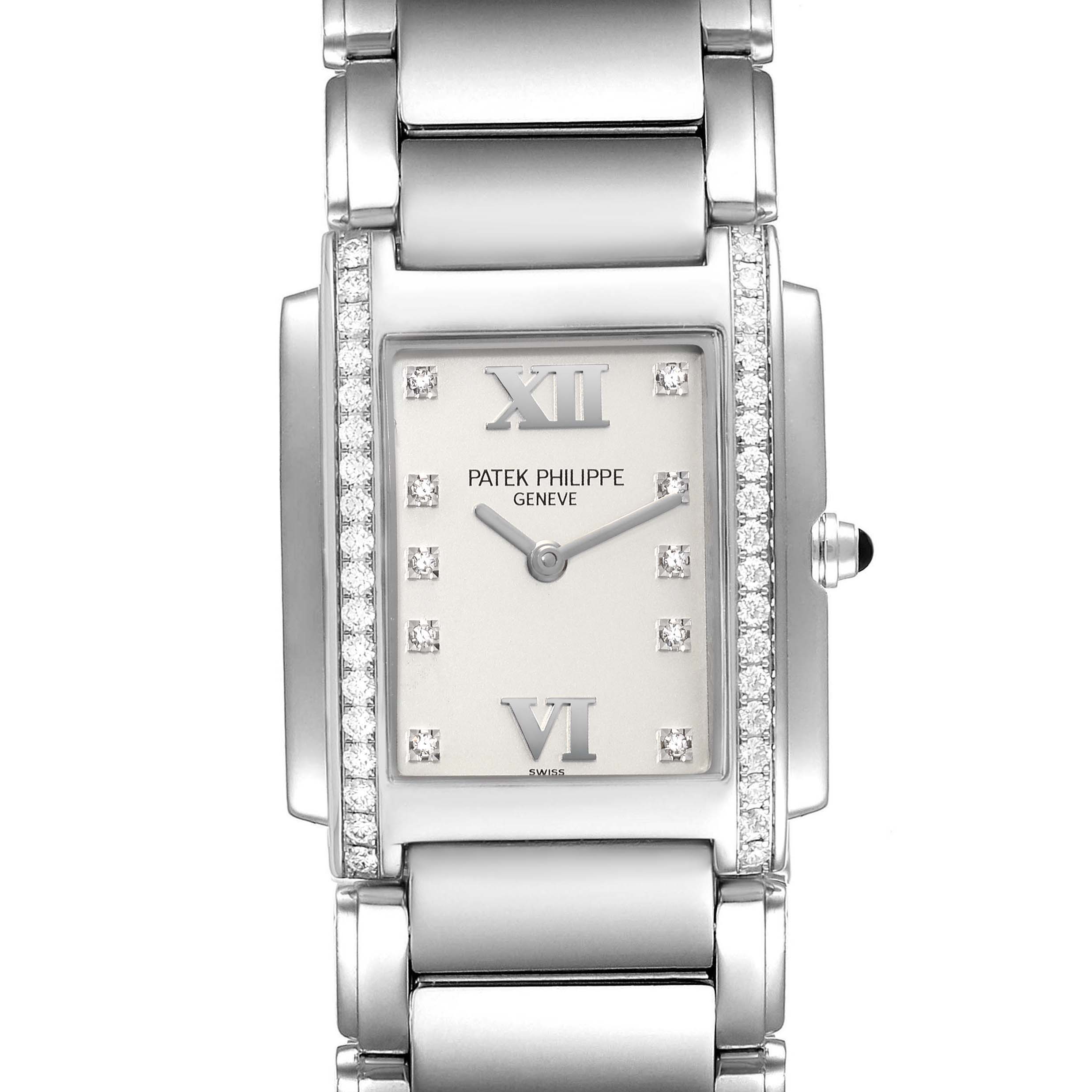 The image shows a frontal view of the Patek Philippe Twenty-4 4910/10A-010 Women's Stainless Steel Silver Dial 4910/10A-010 Women's Stainless Steel Silver Dial watch, highlighting its rectangular face, diamond accents, and bracelet links.