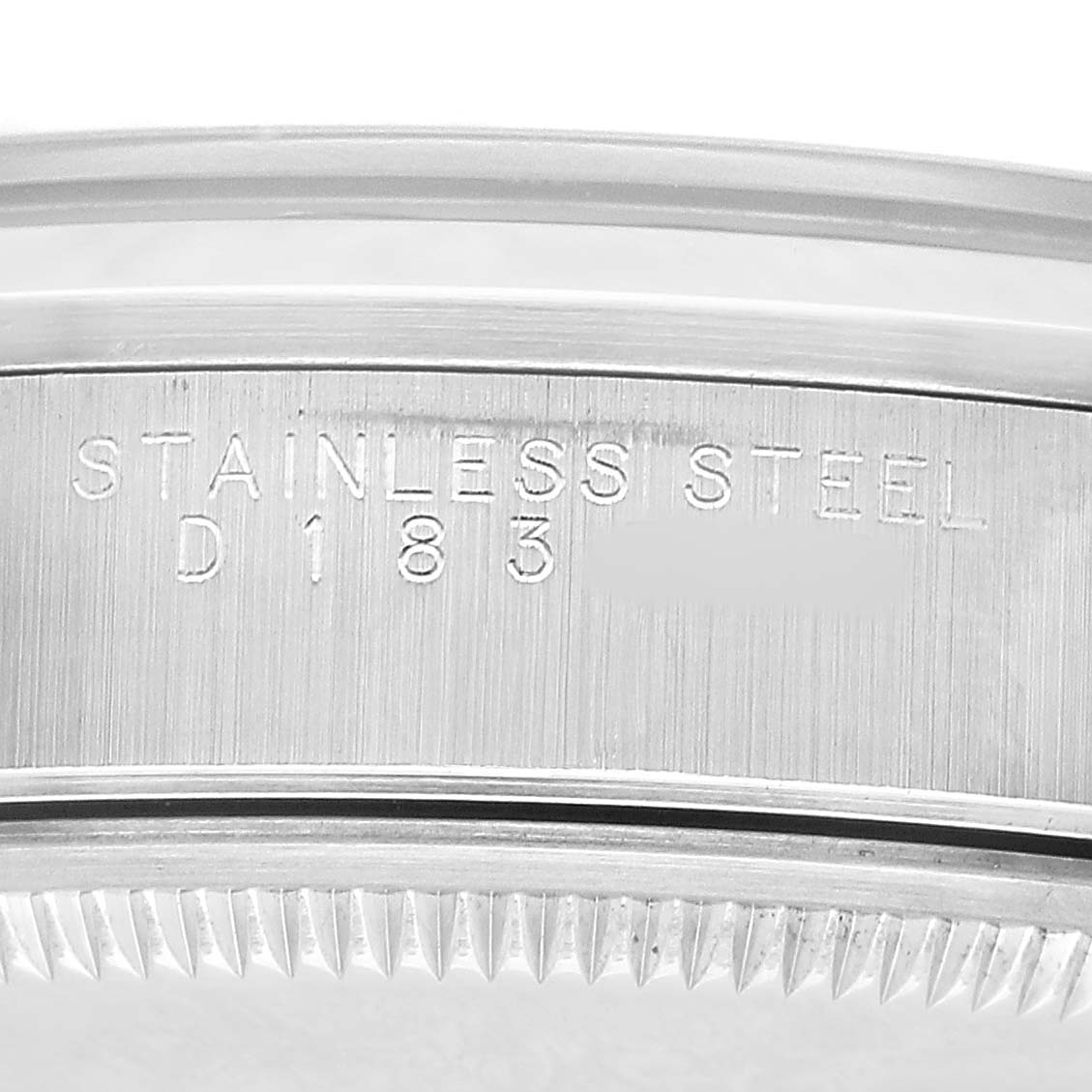The image shows the stainless steel case side of a Rolex Air-King 14000 Men's Stainless Steel Black Dial, highlighting the model's engraved details.