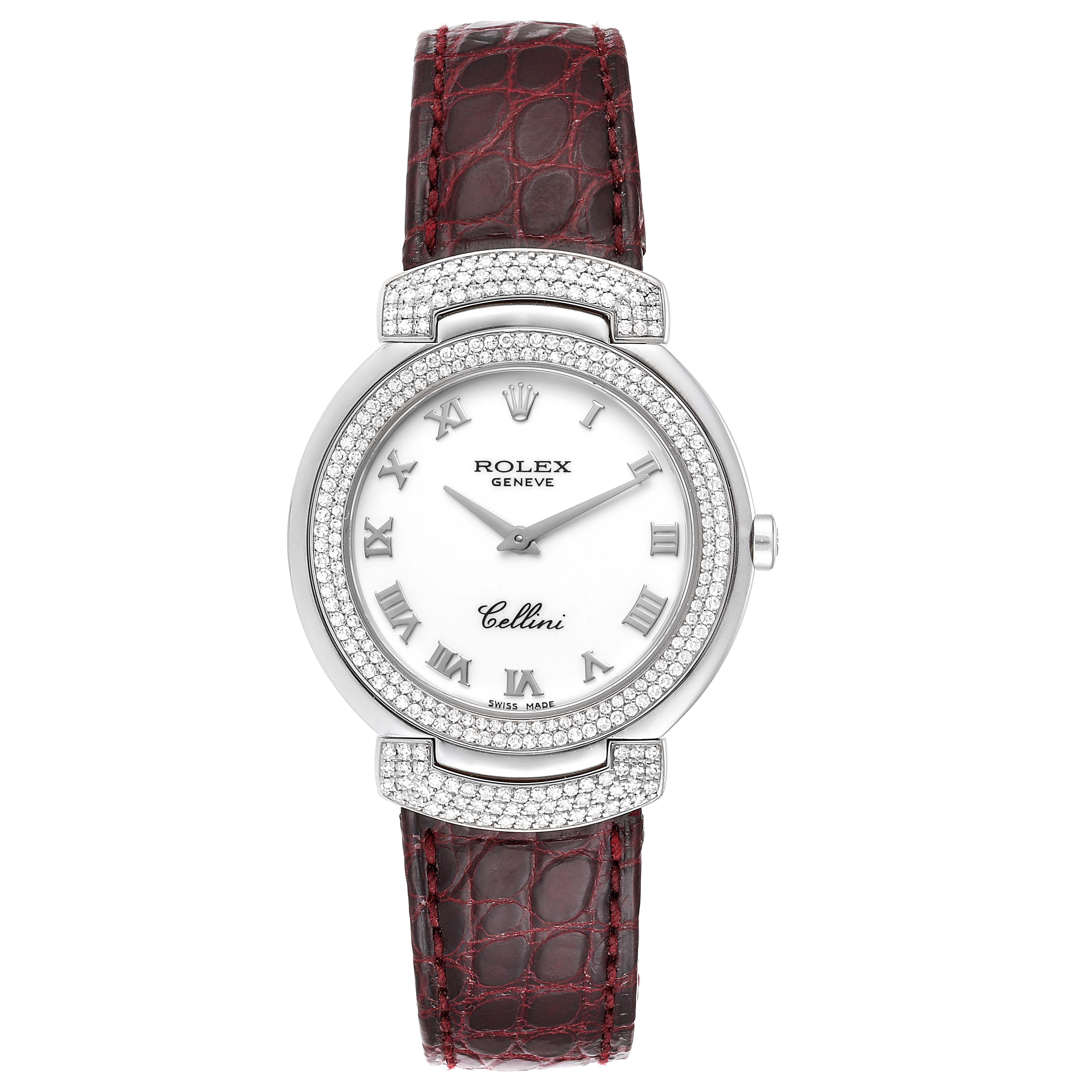 This image shows a front view of a Rolex Cellini 6683/9 Women's White Gold White Dial 6683/9 Women's White Gold White Dial watch with a white dial, Roman numerals, diamond-studded bezel, and a brown leather strap.