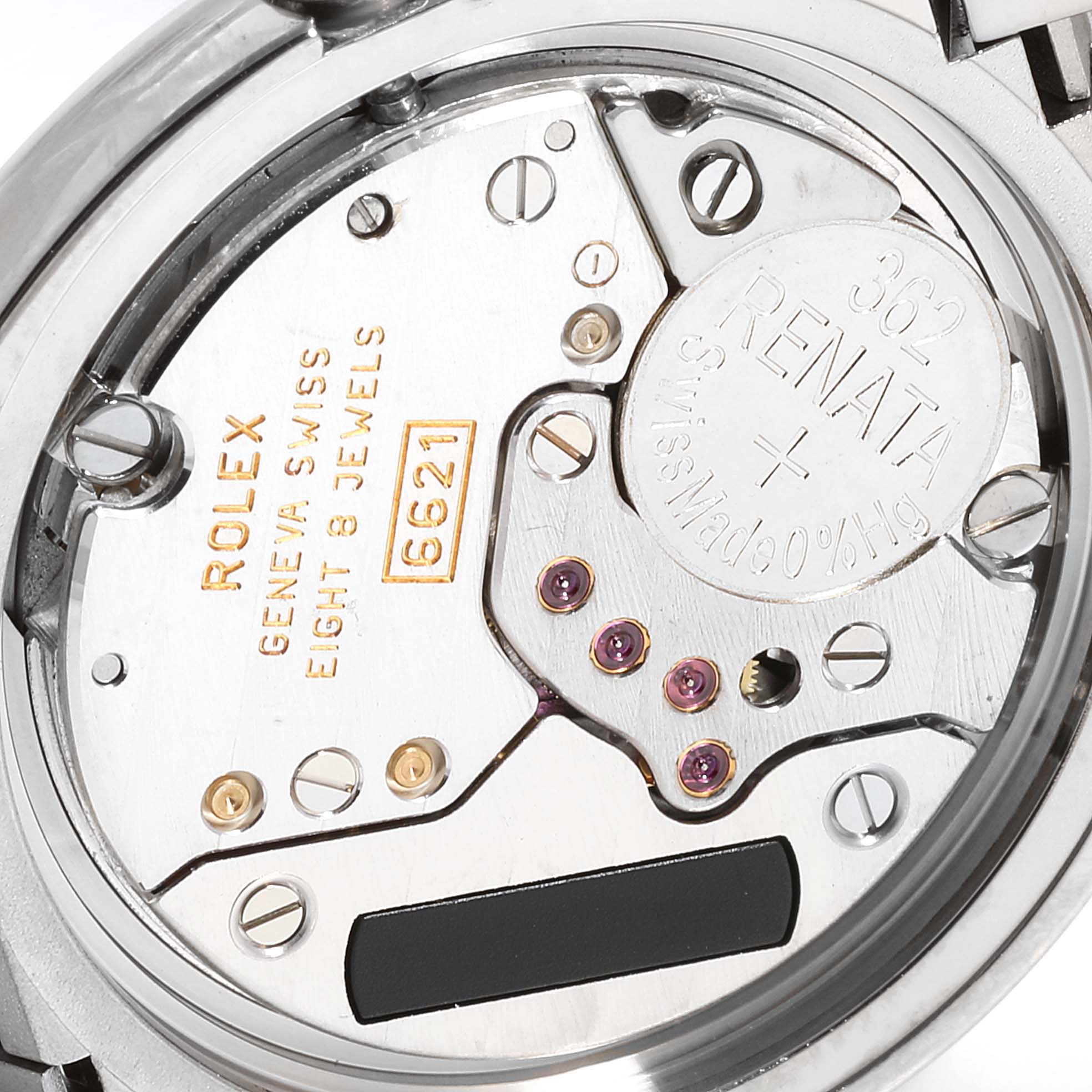 This image shows the inner mechanism of a Rolex Cellini 6672 Women's White Gold Silver Dial 6672 Women's White Gold Silver Dial watch with the battery and internal components visible.