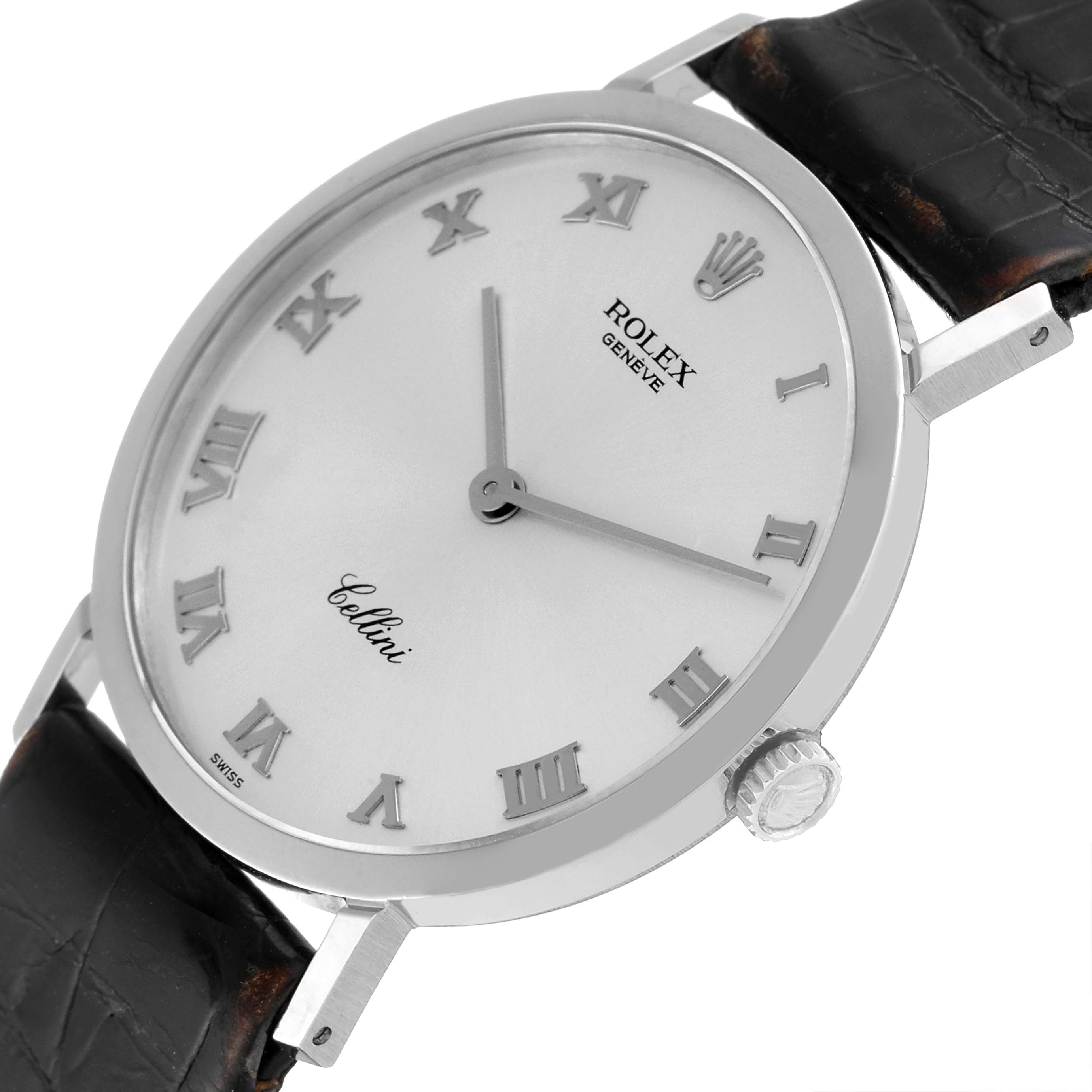 The image shows a close-up angled view of the Rolex Cellini 4112 Men
s White Gold Silver Dial 4112 Men
s White Gold Silver Dial watch, highlighting the face, crown, and part of the strap.