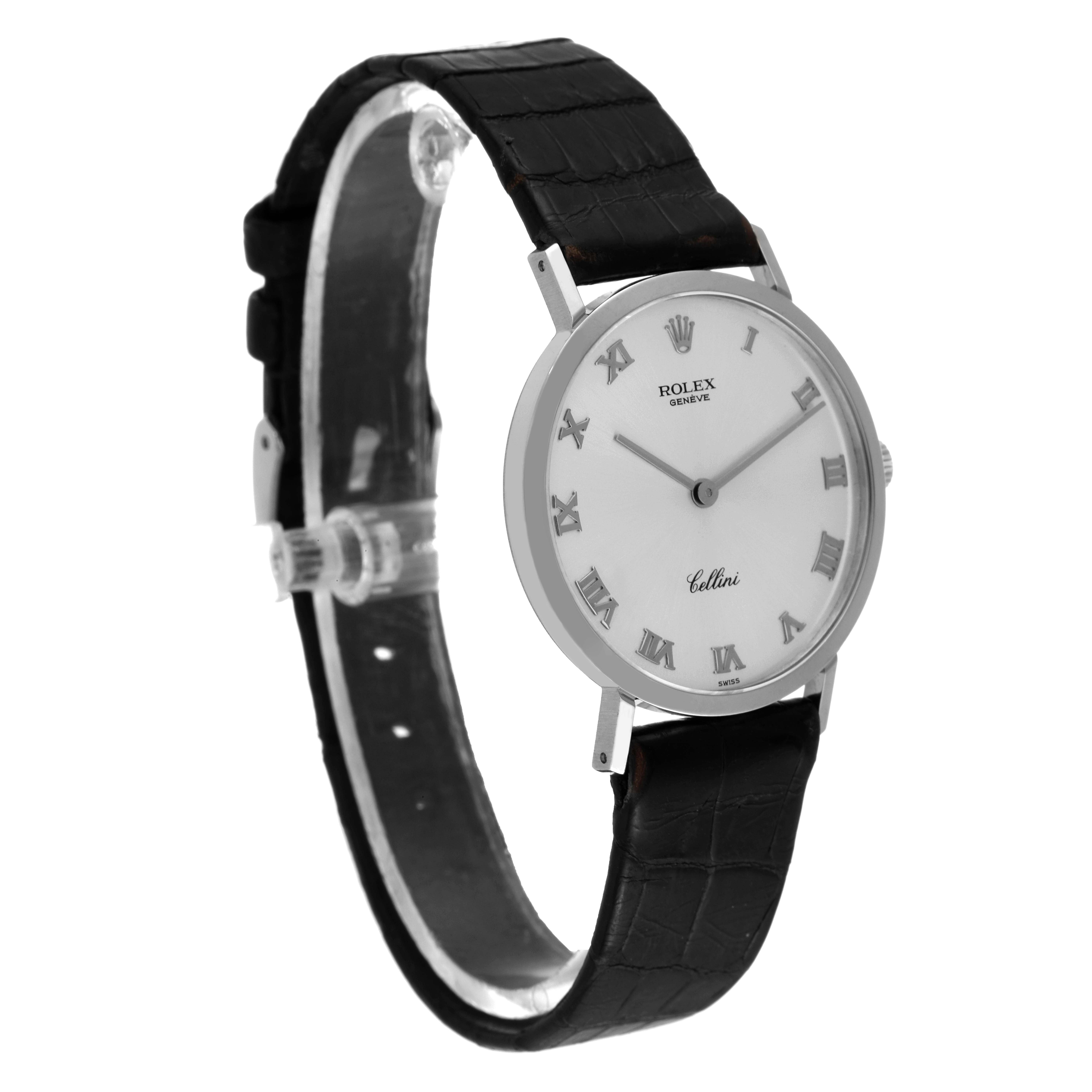 The Rolex Cellini 4112 Men
s White Gold Silver Dial 4112 Men
s White Gold Silver Dial watch is shown from a side angle, displaying its face, Roman numeral dial, and black leather strap.
