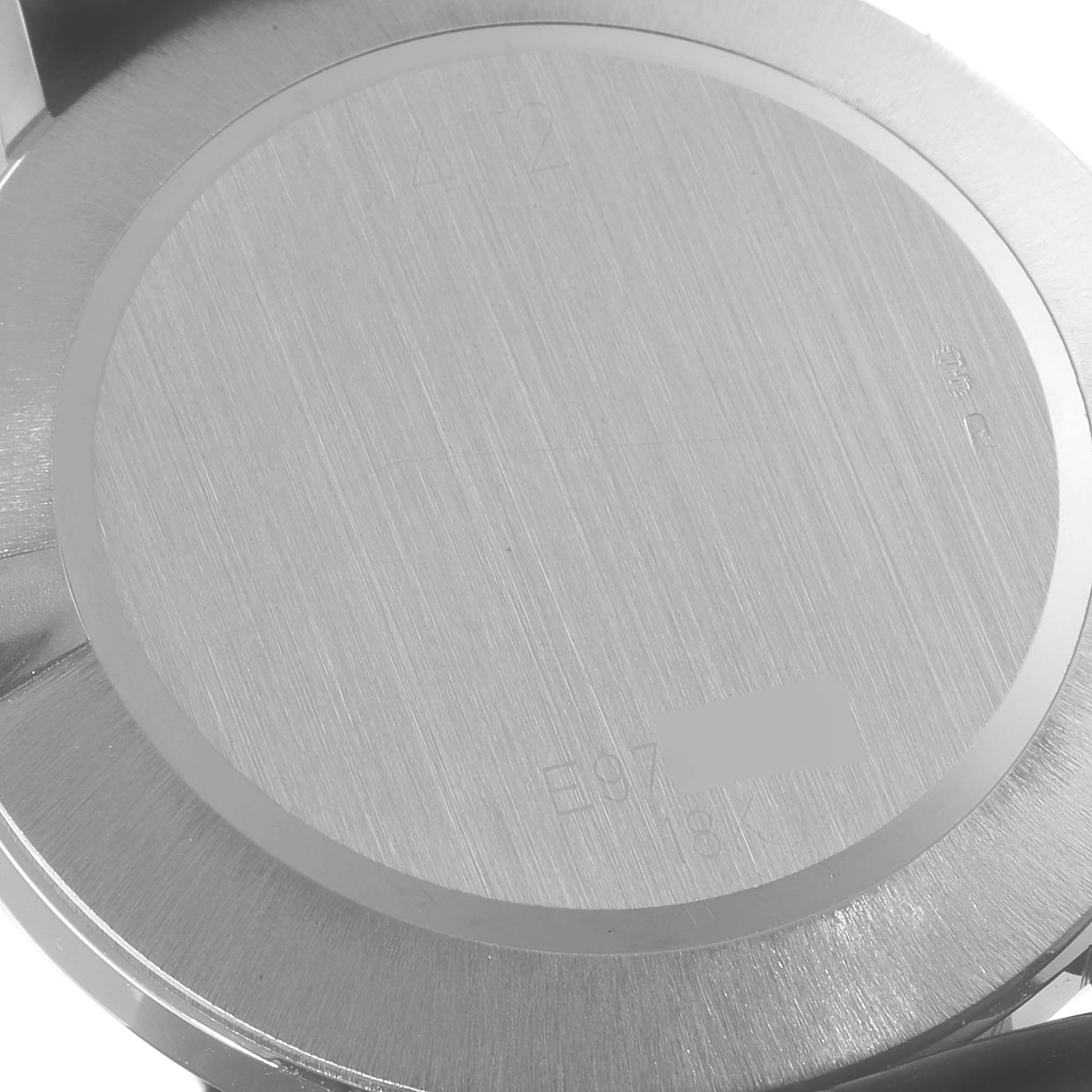 This image shows the back case of a Rolex Cellini 4112 Men
s White Gold Silver Dial 4112 Men
s White Gold Silver Dial watch at a close-up angle.