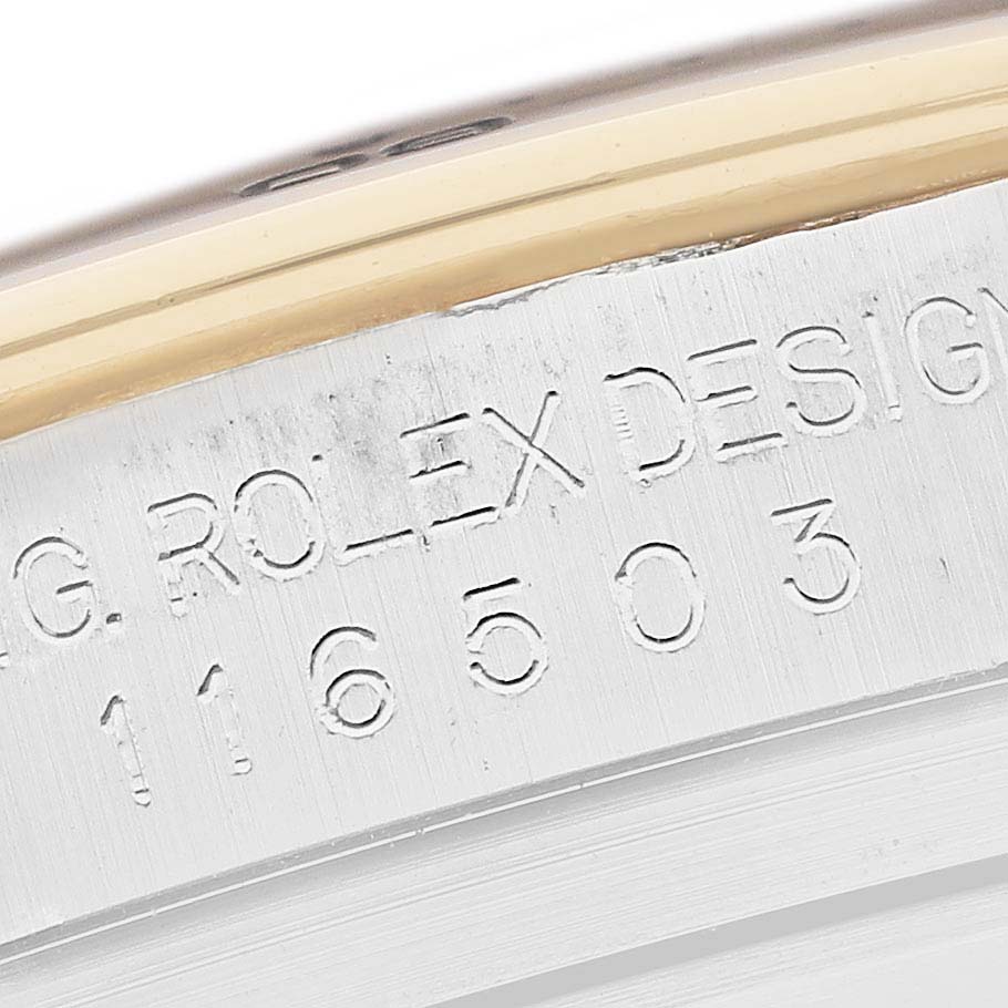 Close-up of the engraved model number and "ROLEX DESIGN" text on the case of a Rolex Daytona 116503 Men
s Steel and Gold (two tone) Black Dial 116503 Men
s Steel and Gold (two tone) Black Dial watch.
