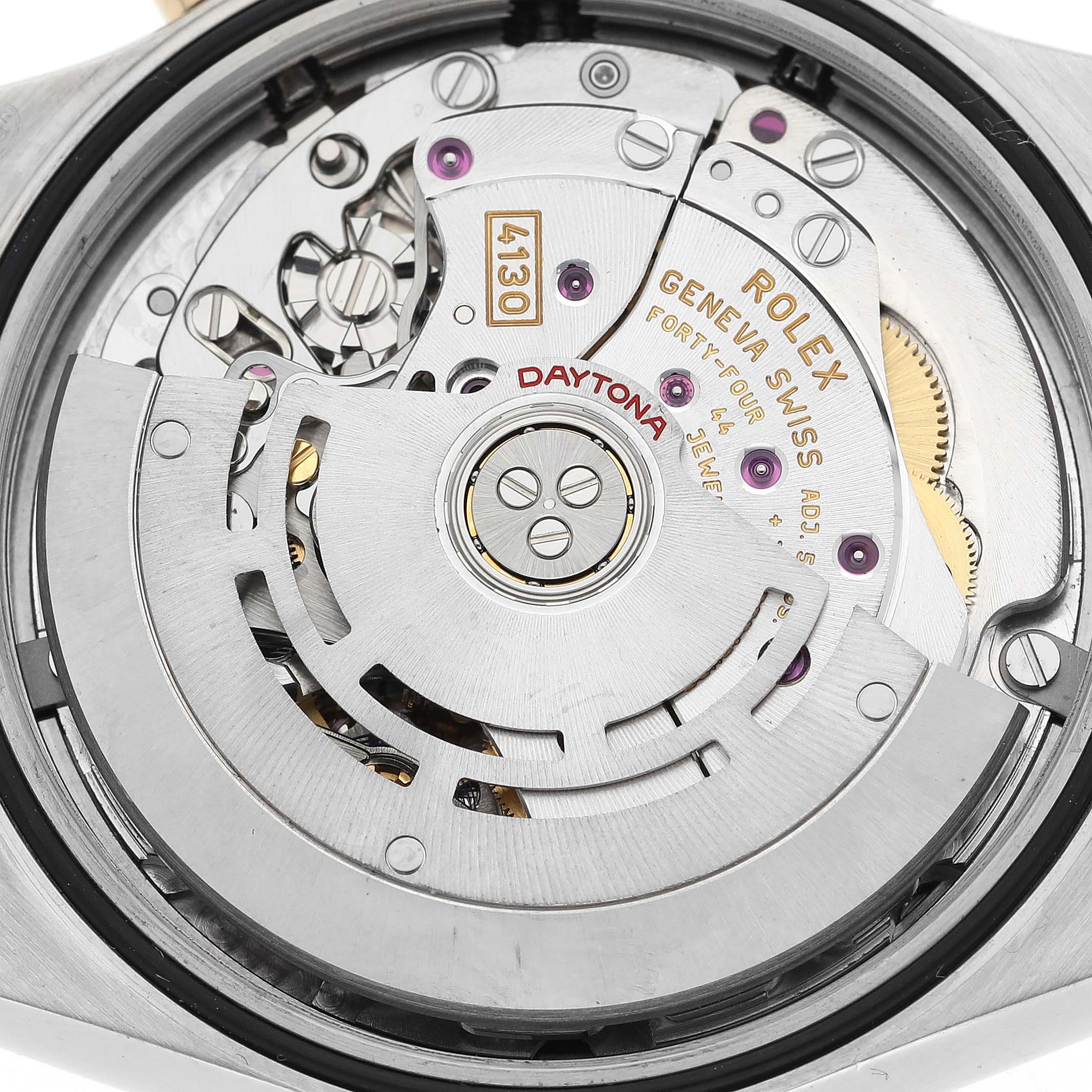 The image shows the inner mechanics and movement of a Rolex Daytona 116503 Men
s Steel and Gold (two tone) Black Dial 116503 Men
s Steel and Gold (two tone) Black Dial watch at a detailed, close-up angle.