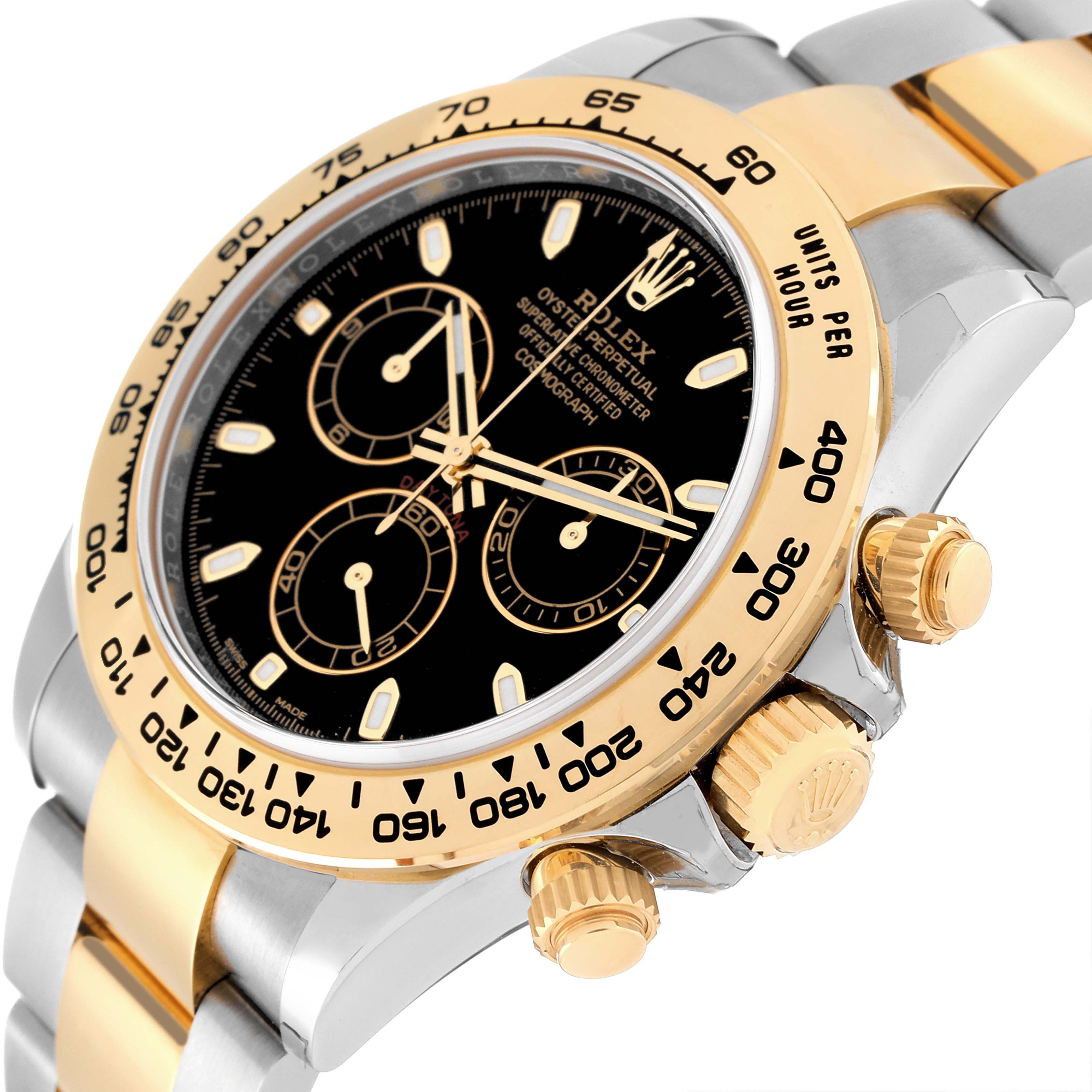 The image shows a close-up of the Rolex Daytona 116503 Men's Steel and Gold (two tone) Black Dial 116503 Men's Steel and Gold (two tone) Black Dial watch's face, bezel, and crown, viewed from a slightly angled side perspective.