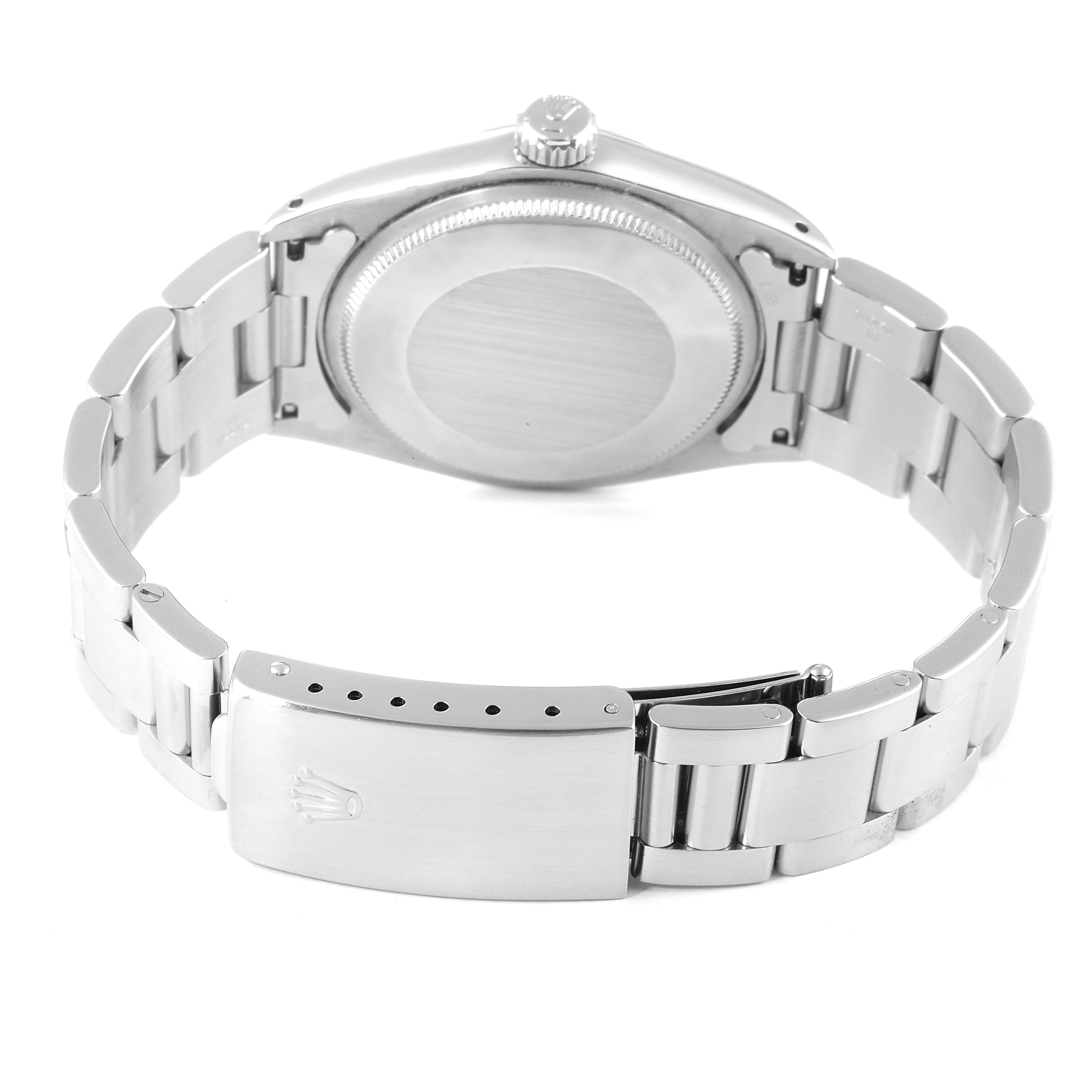 The image shows the back case and bracelet clasp of a Vintage Collection model by Rolex.