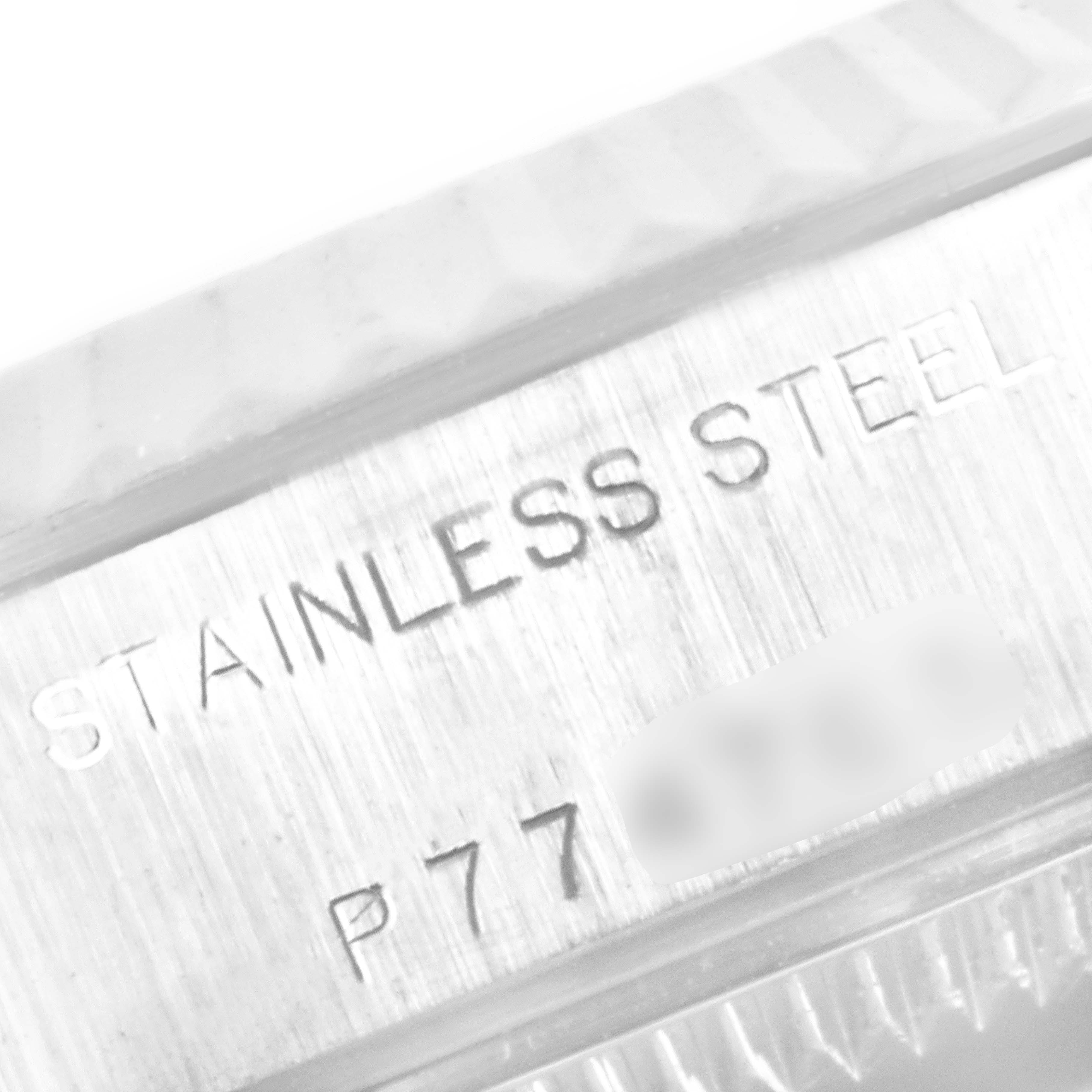 This image shows a close-up angle of the stainless steel casing of the Rolex Datejust 79174 Women
s Stainless Steel Silver Dial 79174 Women
s Stainless Steel Silver Dial watch, focusing on the engraved text.