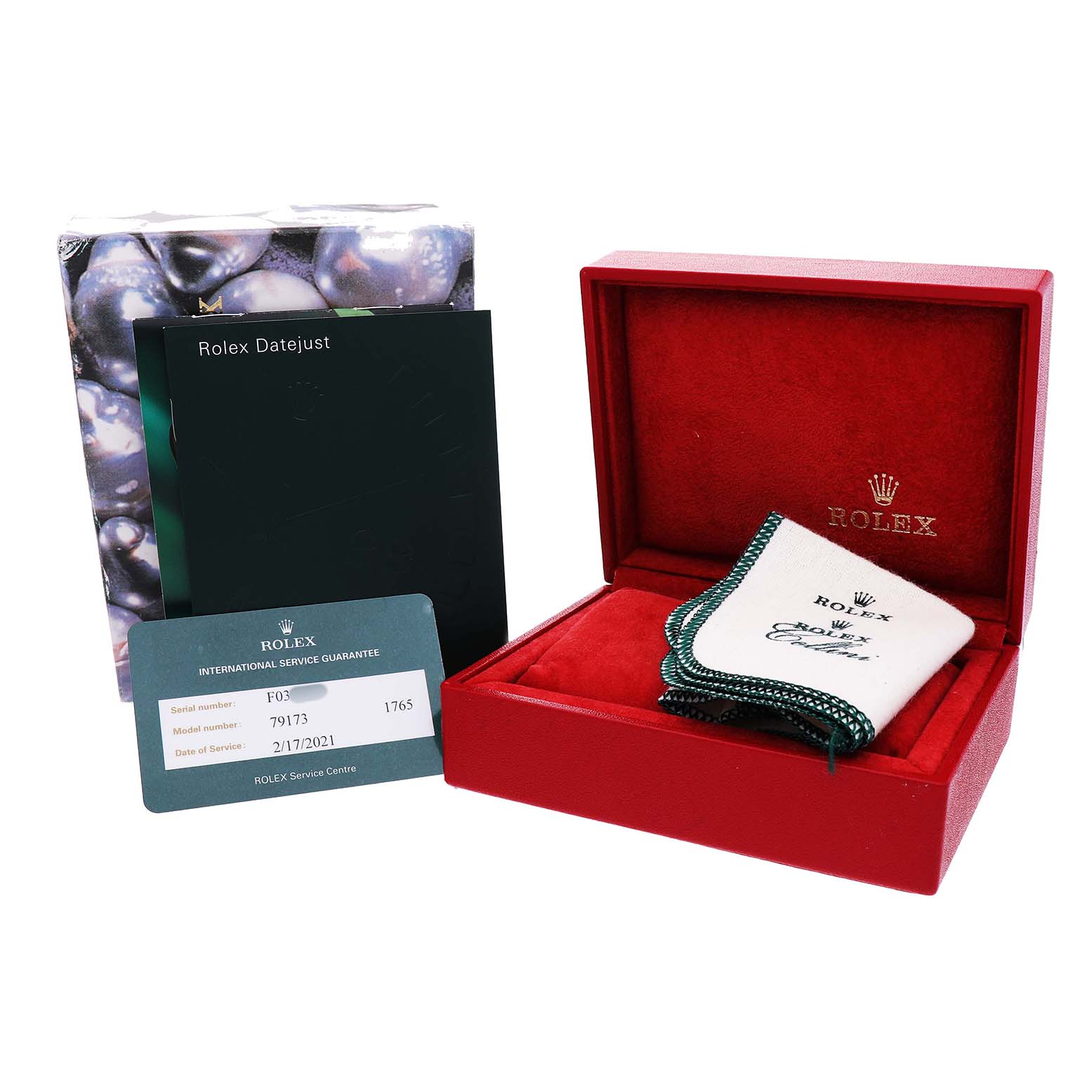 The image shows a Rolex Datejust 79173 Women's Stainless Steel White Dial box, service card, manuals, and a polishing cloth.
