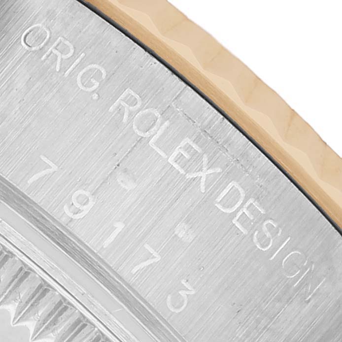 The image shows a close-up of the Rolex Datejust 79173 Women's Stainless Steel White Dial case side, highlighting the engraved model number and fluted bezel.